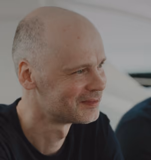 Candid photo of a smiling DualEntry employee in the office