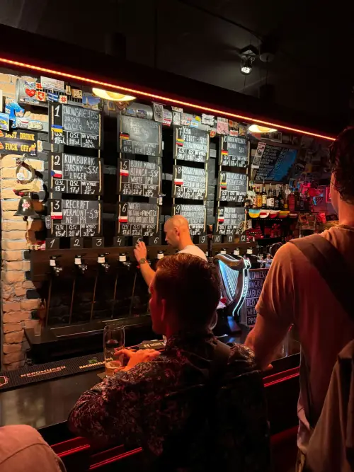 DualEntry team members gathered at a taproom during a team outing