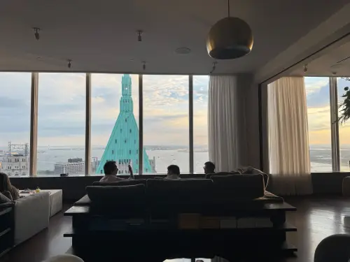 DualEntry office lounge with views of the Manhattan skyline at dusk