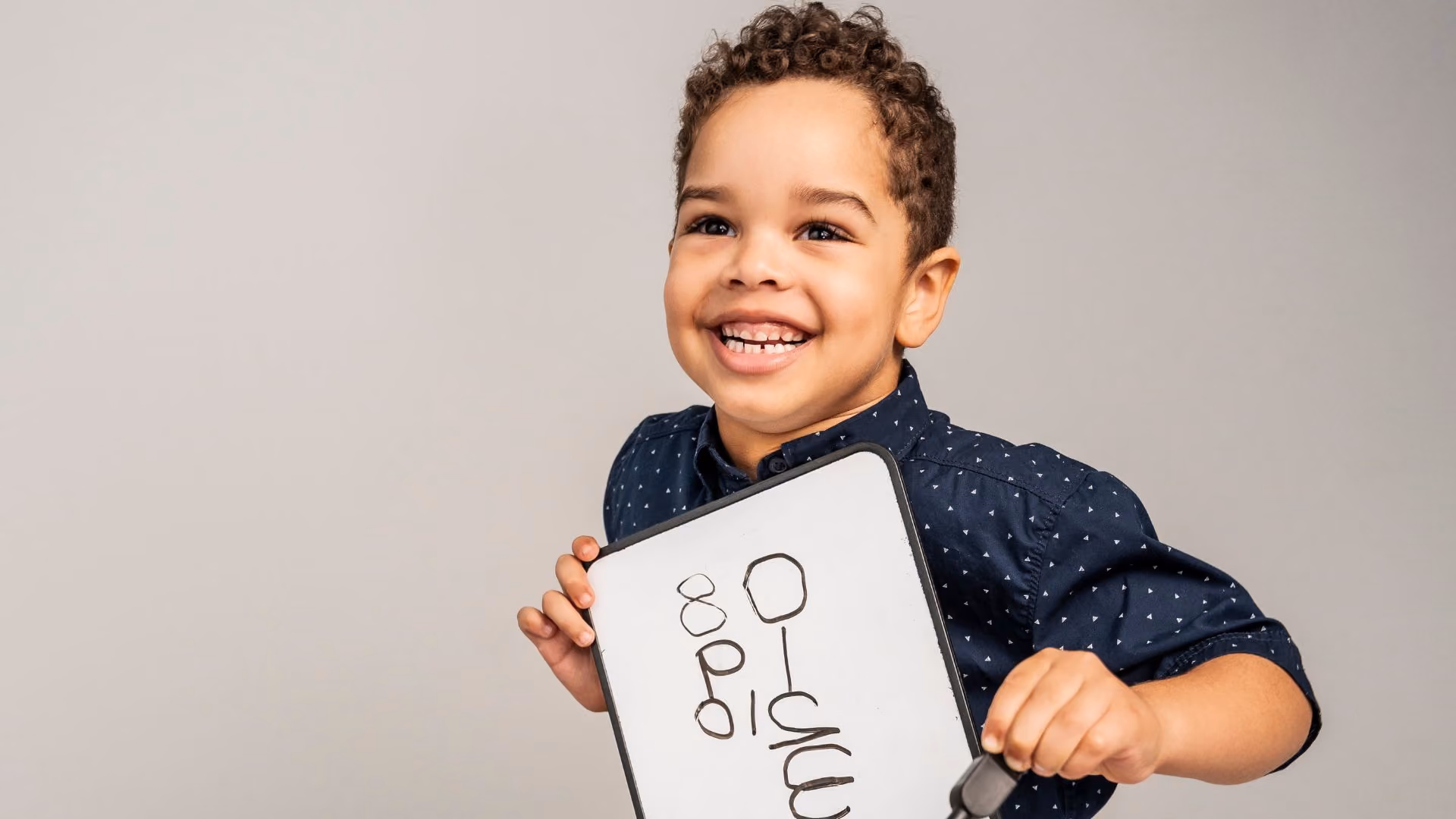 young autistic boy with whiteboard