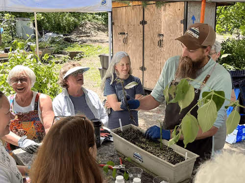 Volunteers and Jefferson County Greenways staff propagating plants at the Ruffner Mountain greenhouse