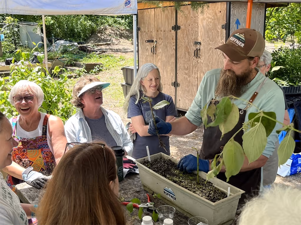 Volunteers and Jefferson County Greenways staff propagating plants at the Ruffner Mountain greenhouse