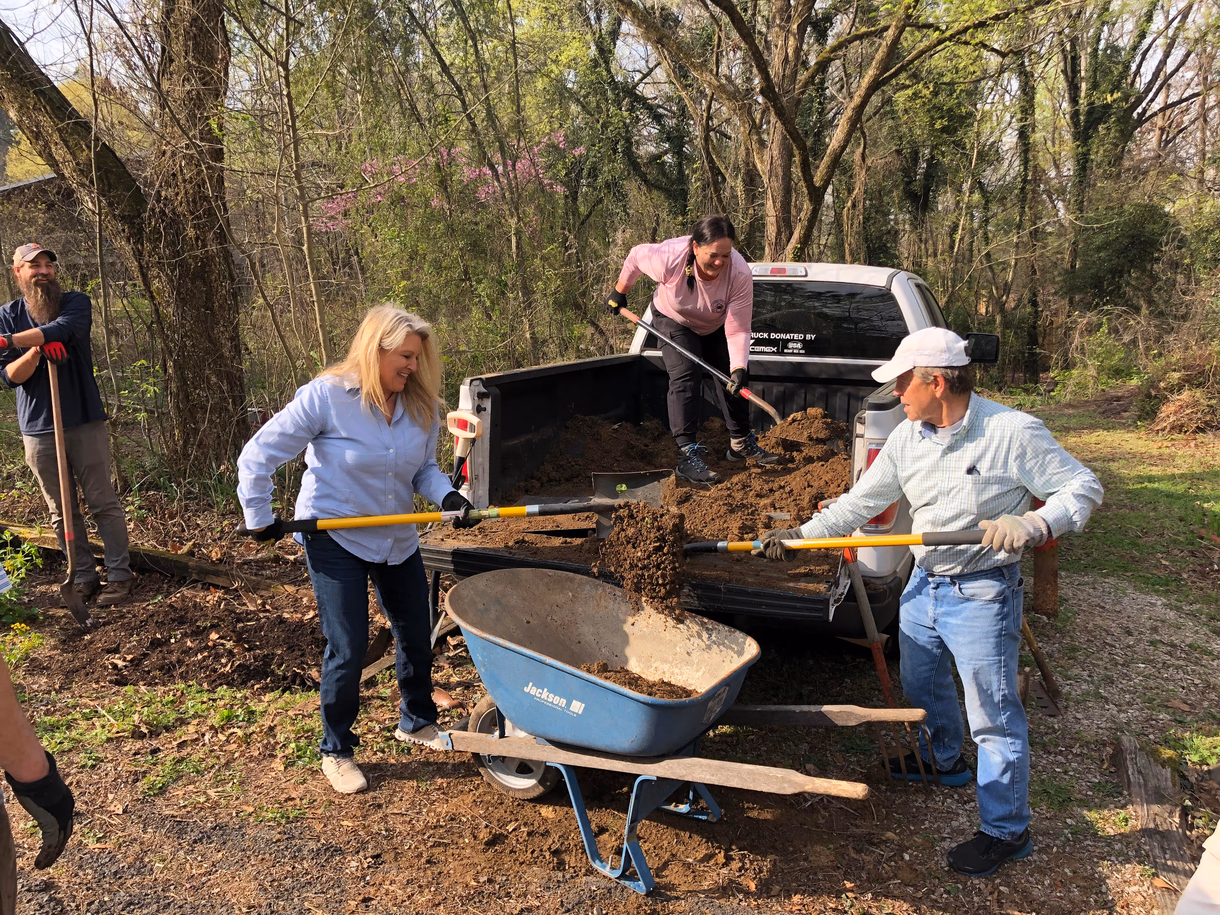 Volunteers helping move soil at Ruffner Mountain