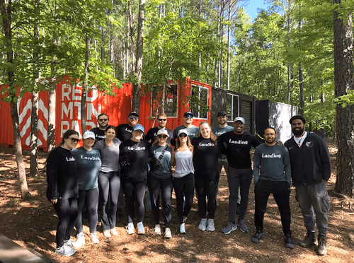 A group of volunteers from Landing at the entrance of Red Mountain Park posing for a group photo 