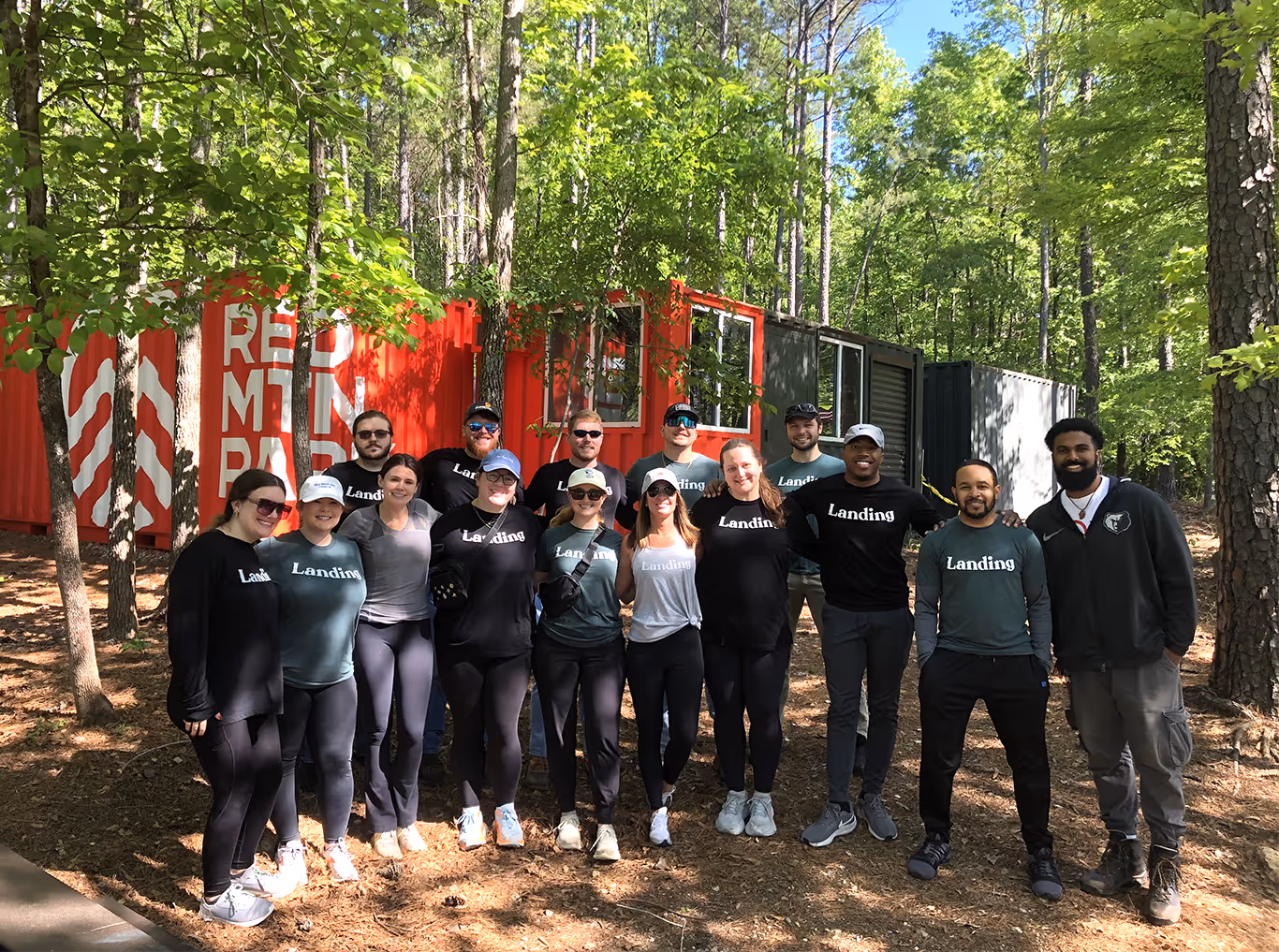 A group of volunteers from Landing at the entrance of Red Mountain Park posing for a group photo 
