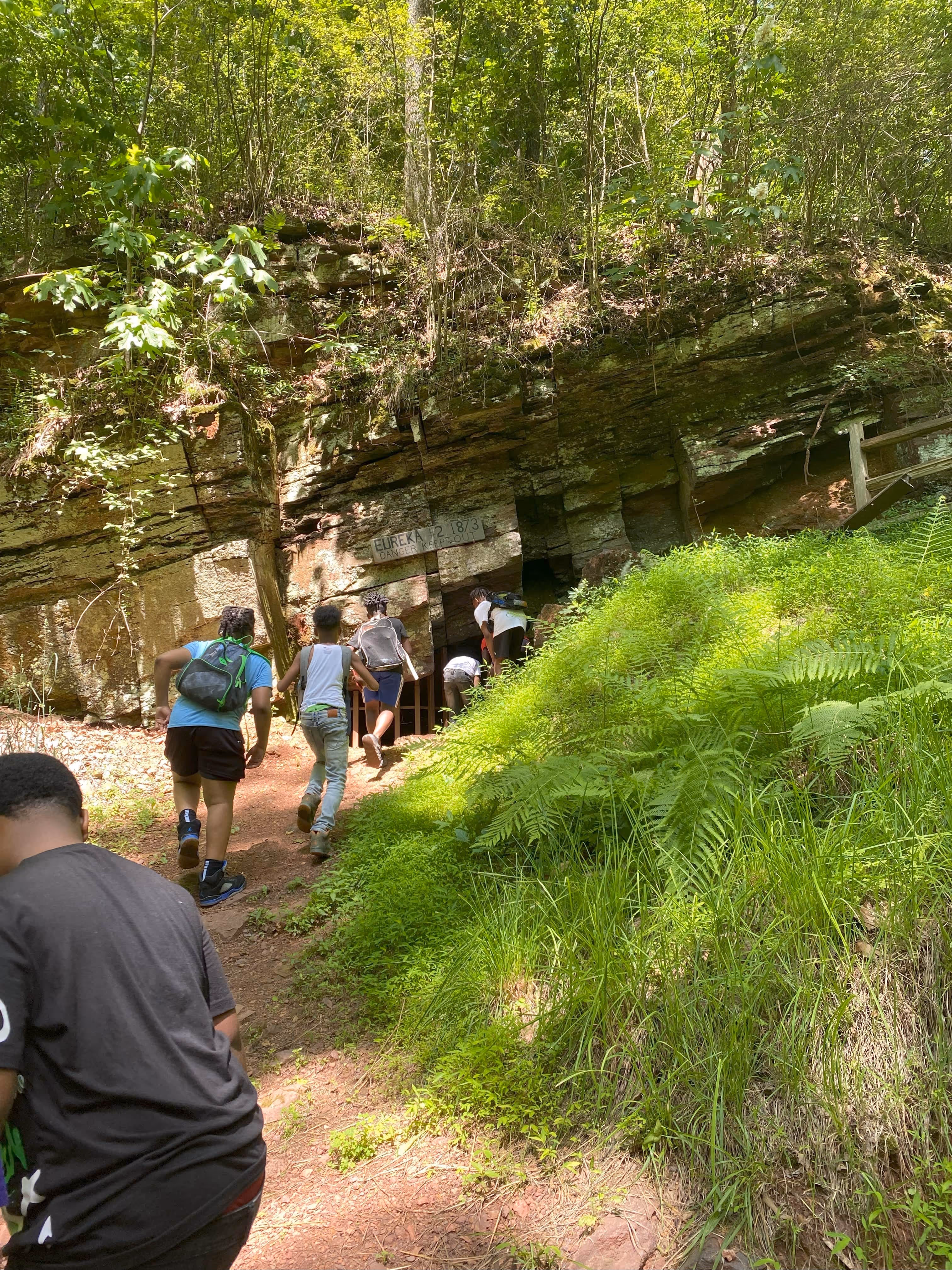 Hikers viewing the Eureka mine at Red Mountain Park