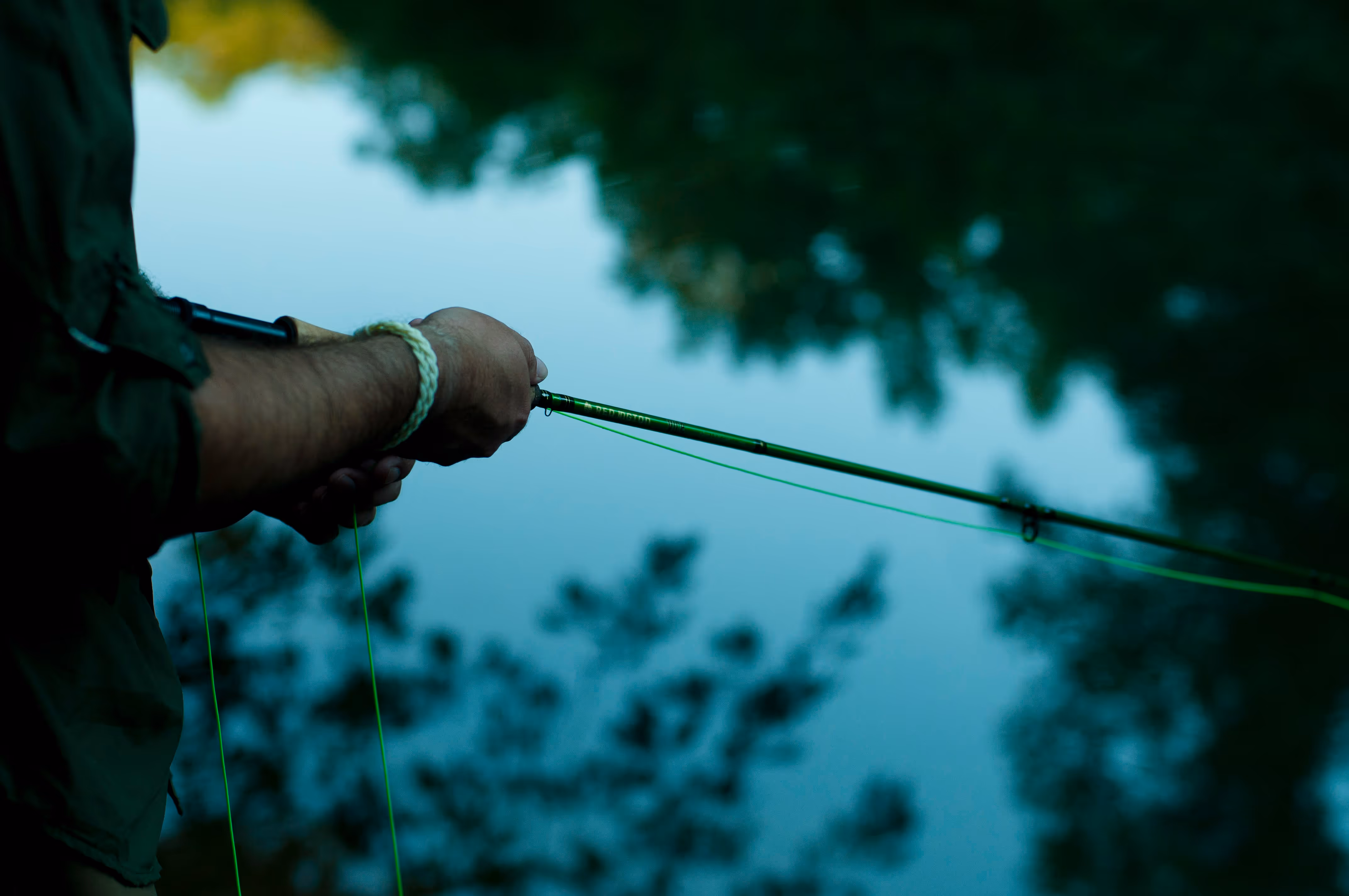 A person fishing at Turkey Creek Nature Preserve. 