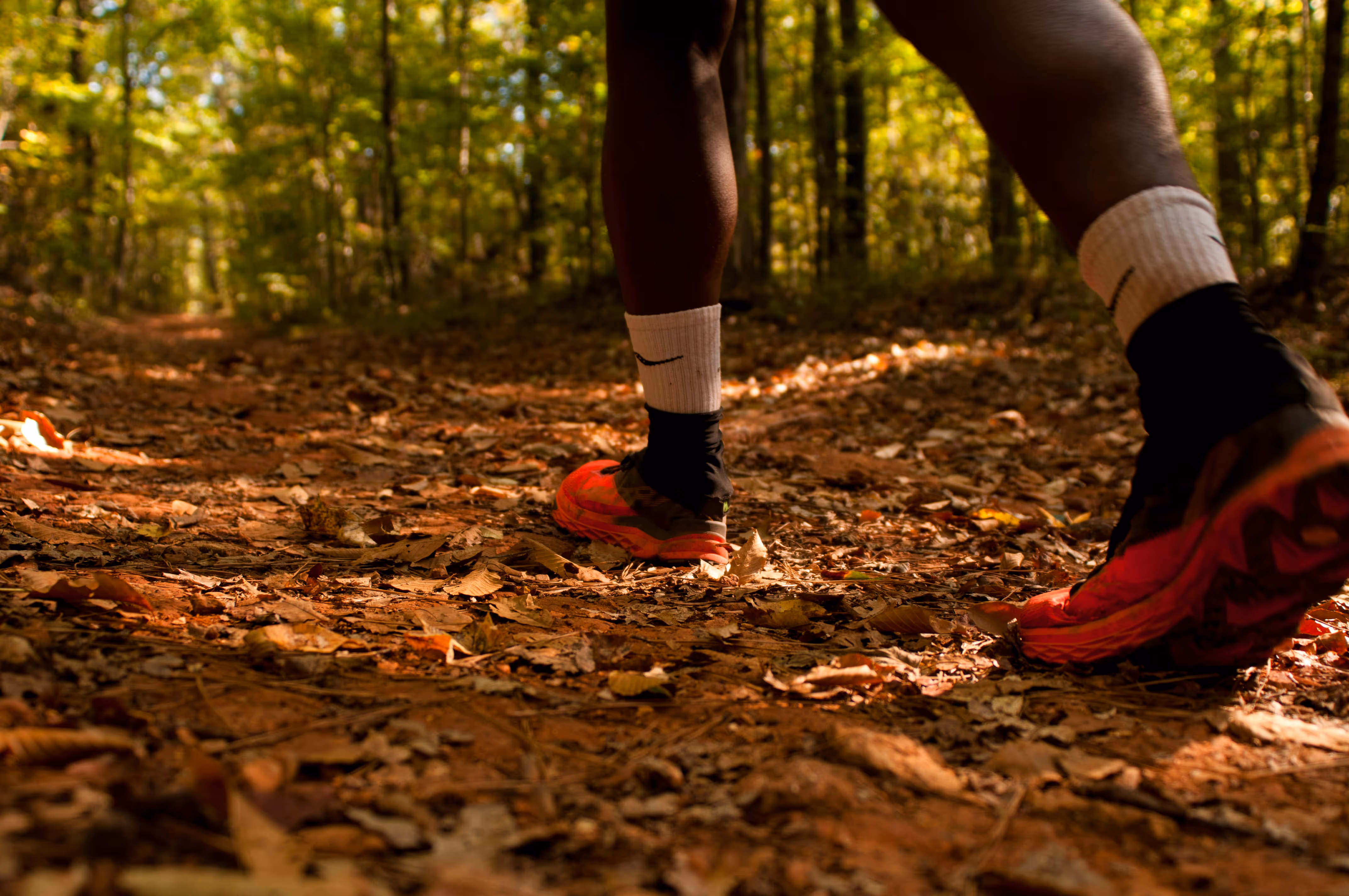 A person hiking on a trail at Red Mountain Park.