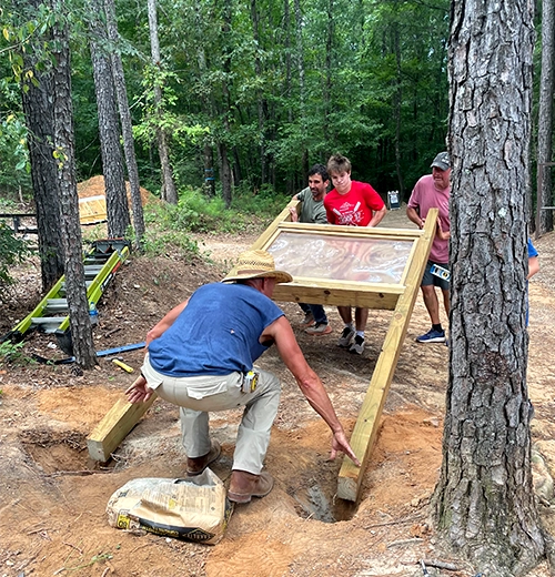 Cannon and others installing one of the kiosks