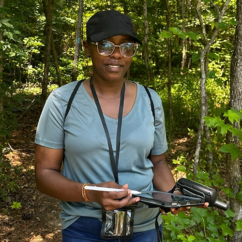 Carolyne on the trails at Turkey Creek Nature Preserve checking location data