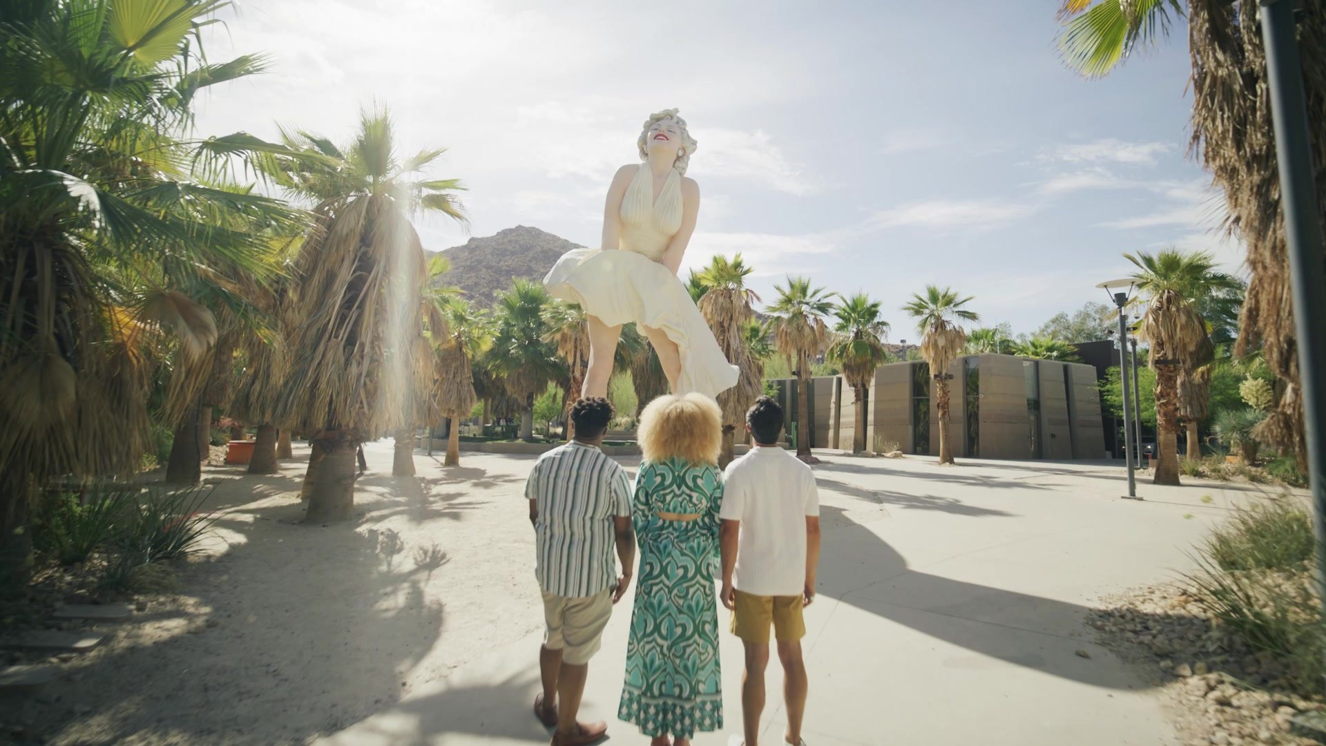 Visitors walking toward the Forever Marilyn statue in Palm Springs