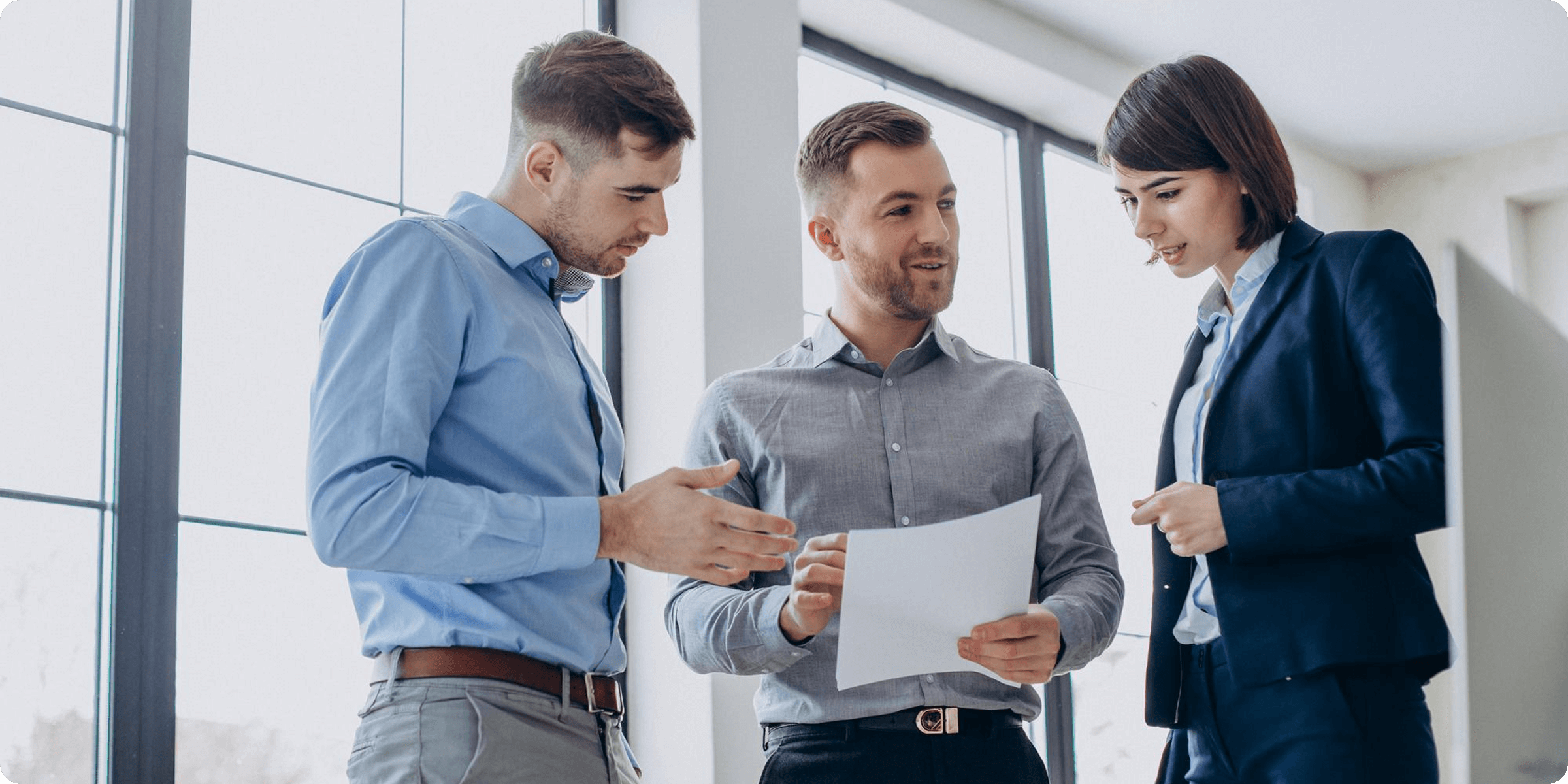 Three business professionals—two men and one woman—collaborate in an office. They’re discussing a document, representing ccMonet’s expert team (tax specialists, business consultants). Our AI - powered finance tools (bookkeeping, dashboards) and industry - tailored services support efficient, compliant financial workflows for diverse businesses.