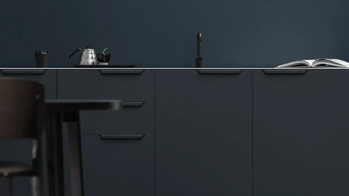 Black kitchen with a sink and cabinets