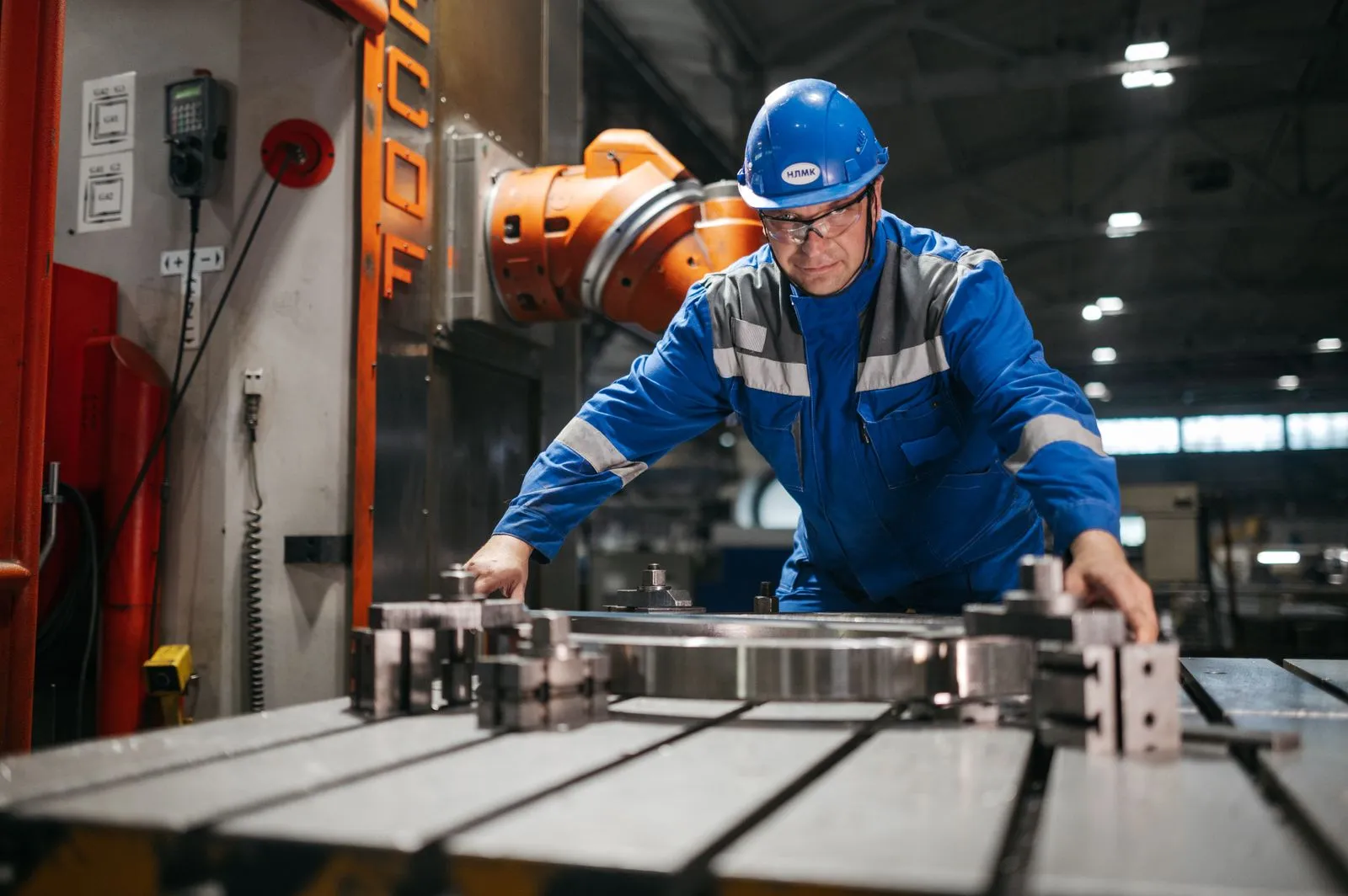 Manufacturing worker inspecting precision machinery in a Campbellfield industrial facility