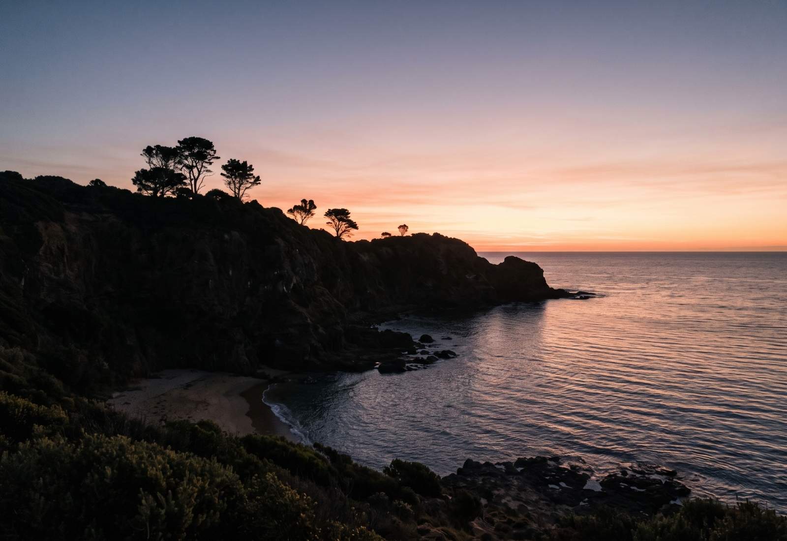 A coastal headland over calm water on the Mornington Peninsula