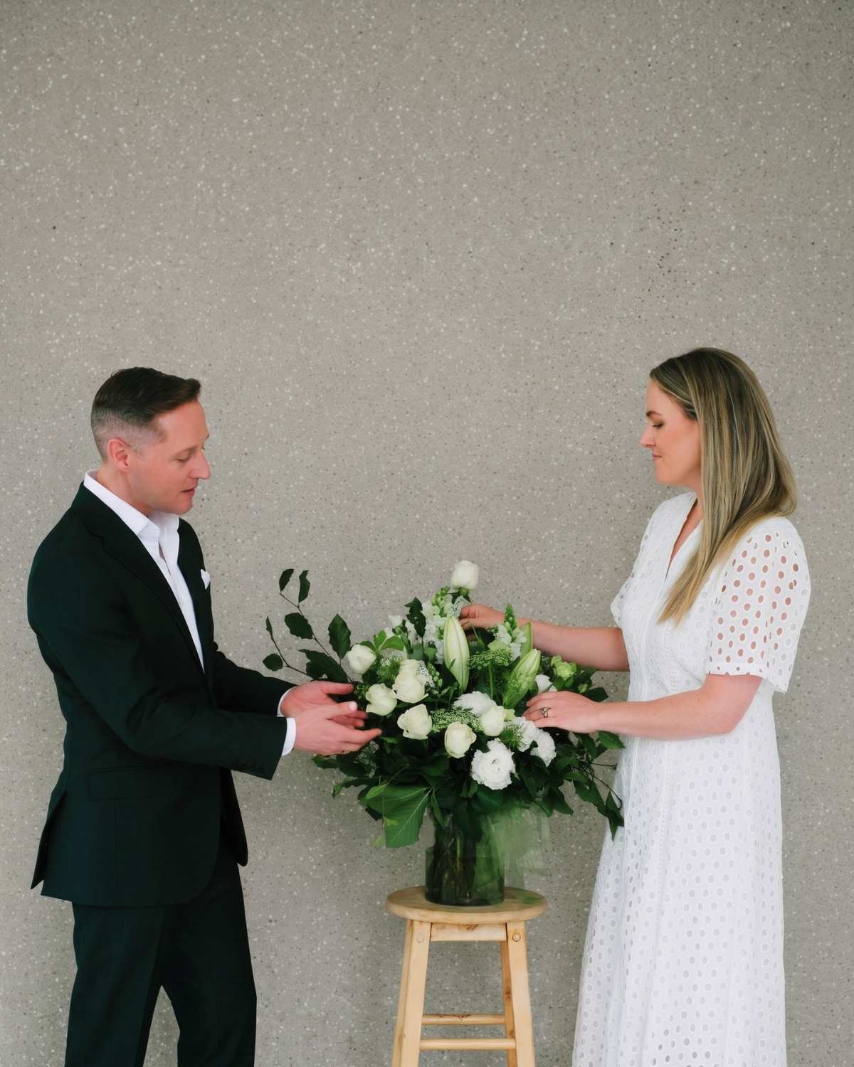 Simon and Sameiko, Candour's founders, arranging a floral tribute together