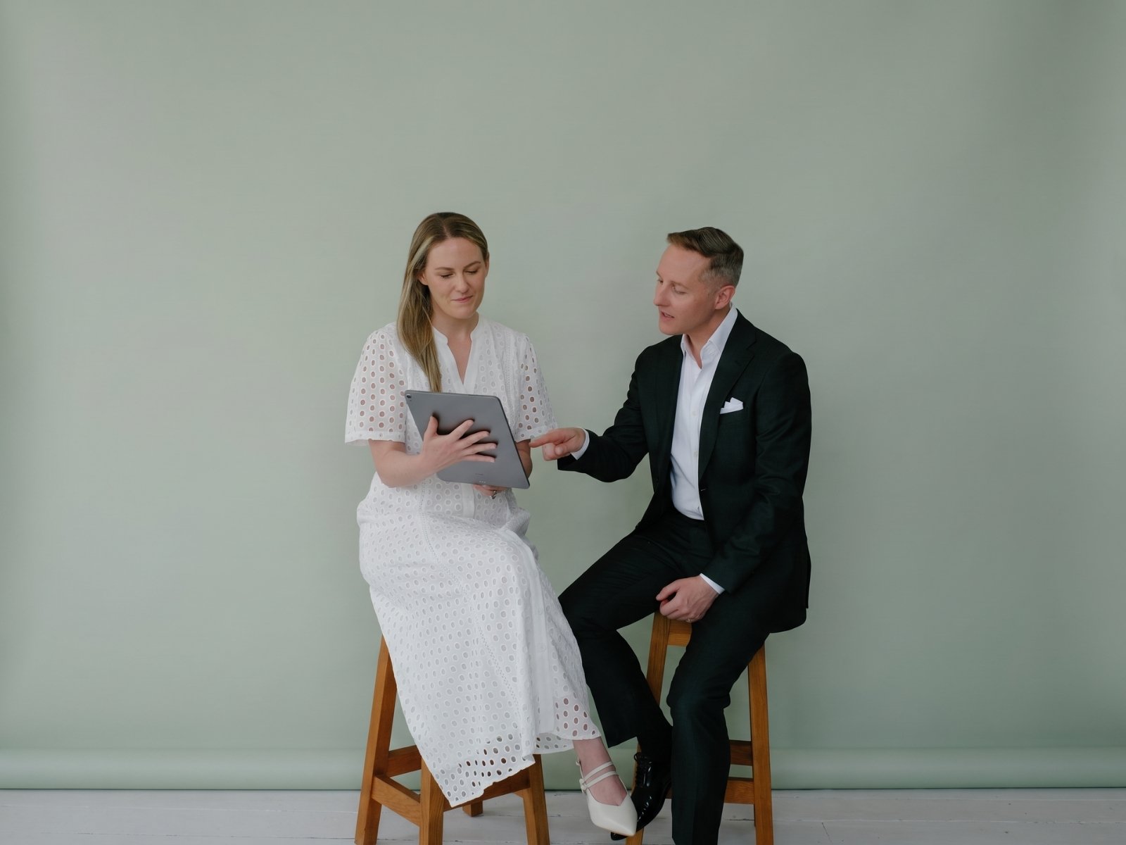 Candour co-founders Sameiko and Simon reviewing farewell choices together on a tablet.