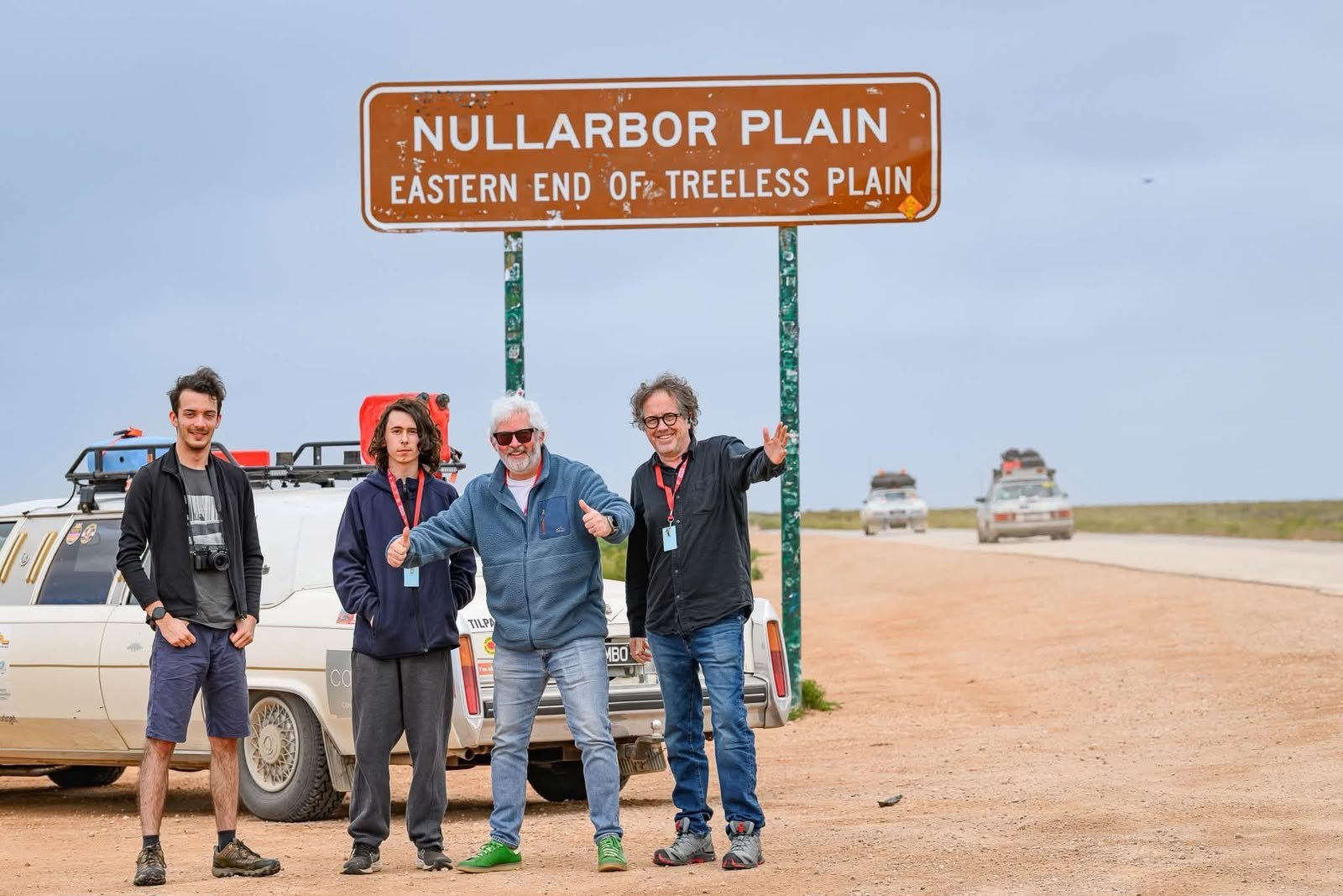The Candour-sponsored Variety Vic Bash car and its crew beneath the Nullarbor Plain sign