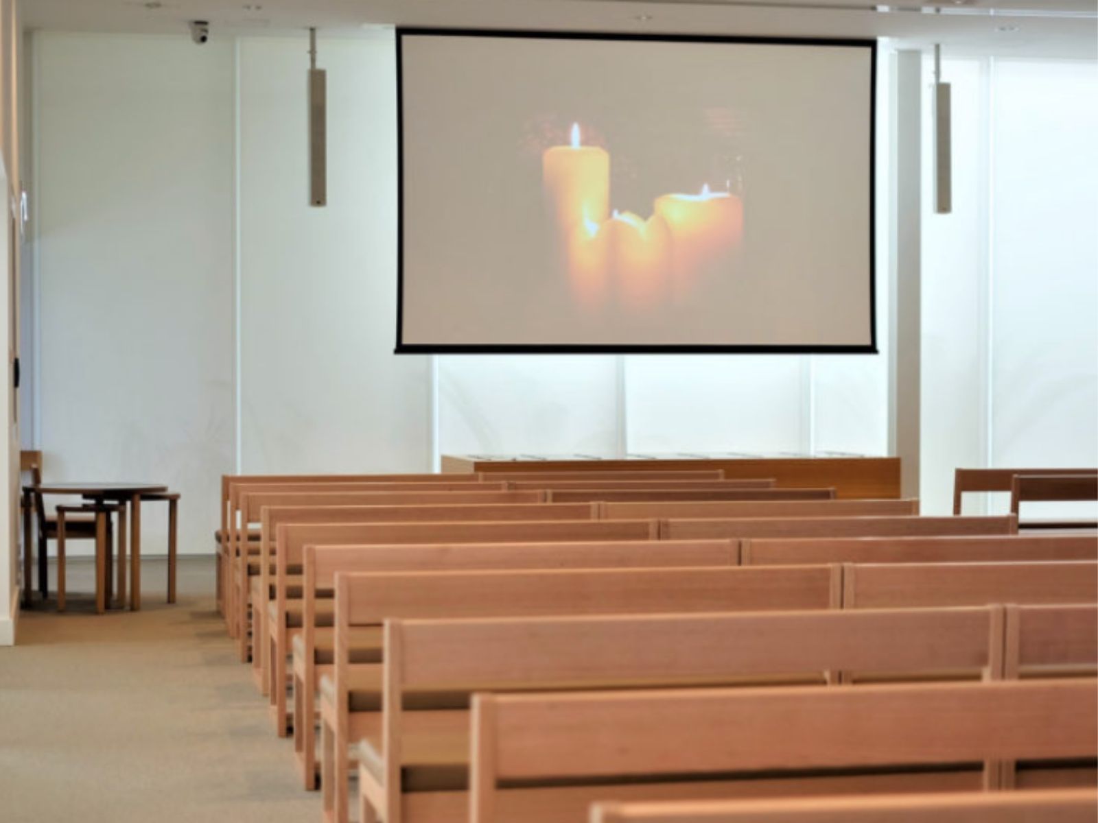 Inside Cumulus chapel showing large projector screen