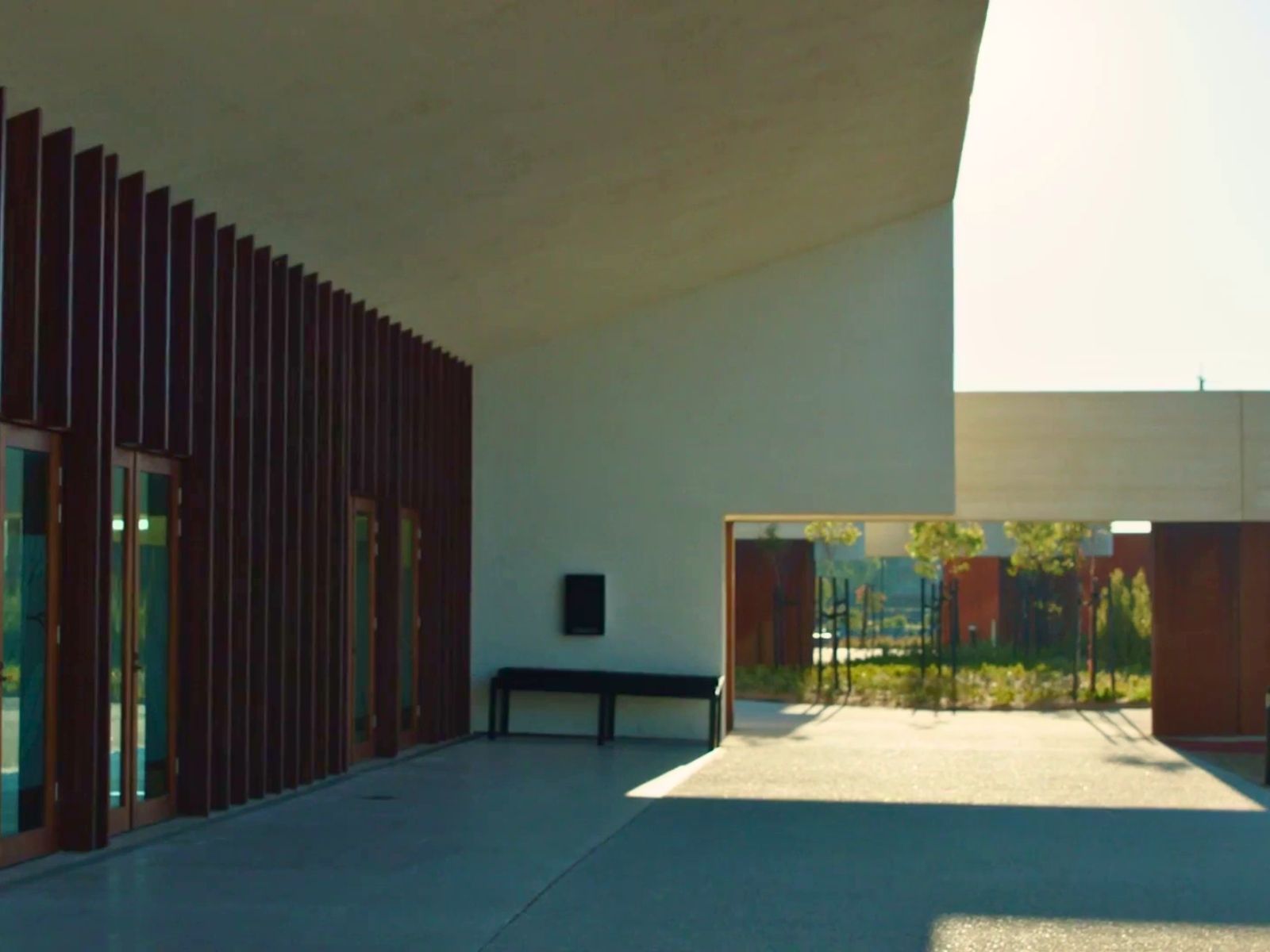 Undercover area outside of the Stratus Chapel at Bunurong Memorial Park. White concrete area just outside the large glass doors.