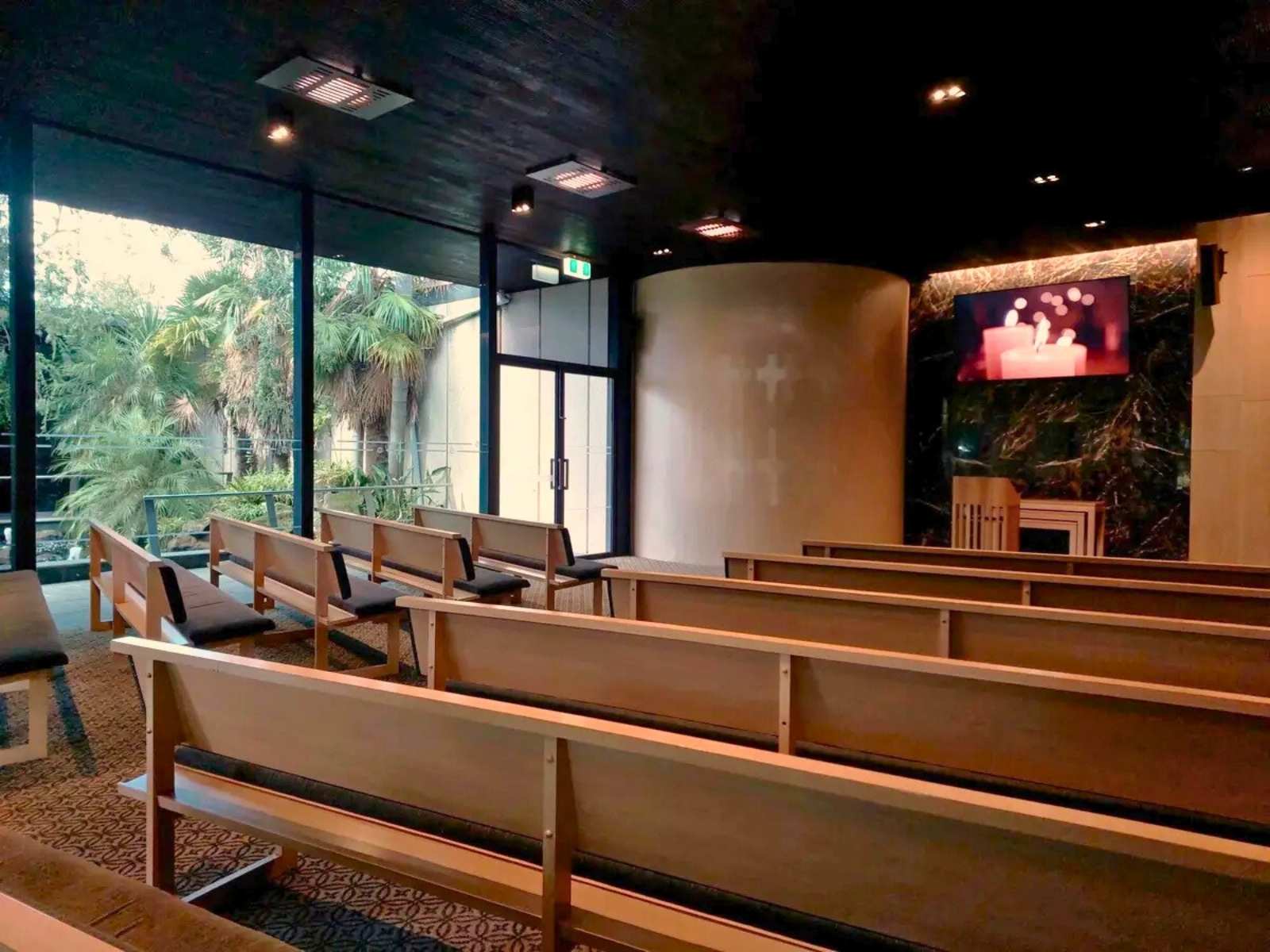 Inside Blair chapel at Springvale Botanical Cemetery. Empty seats.