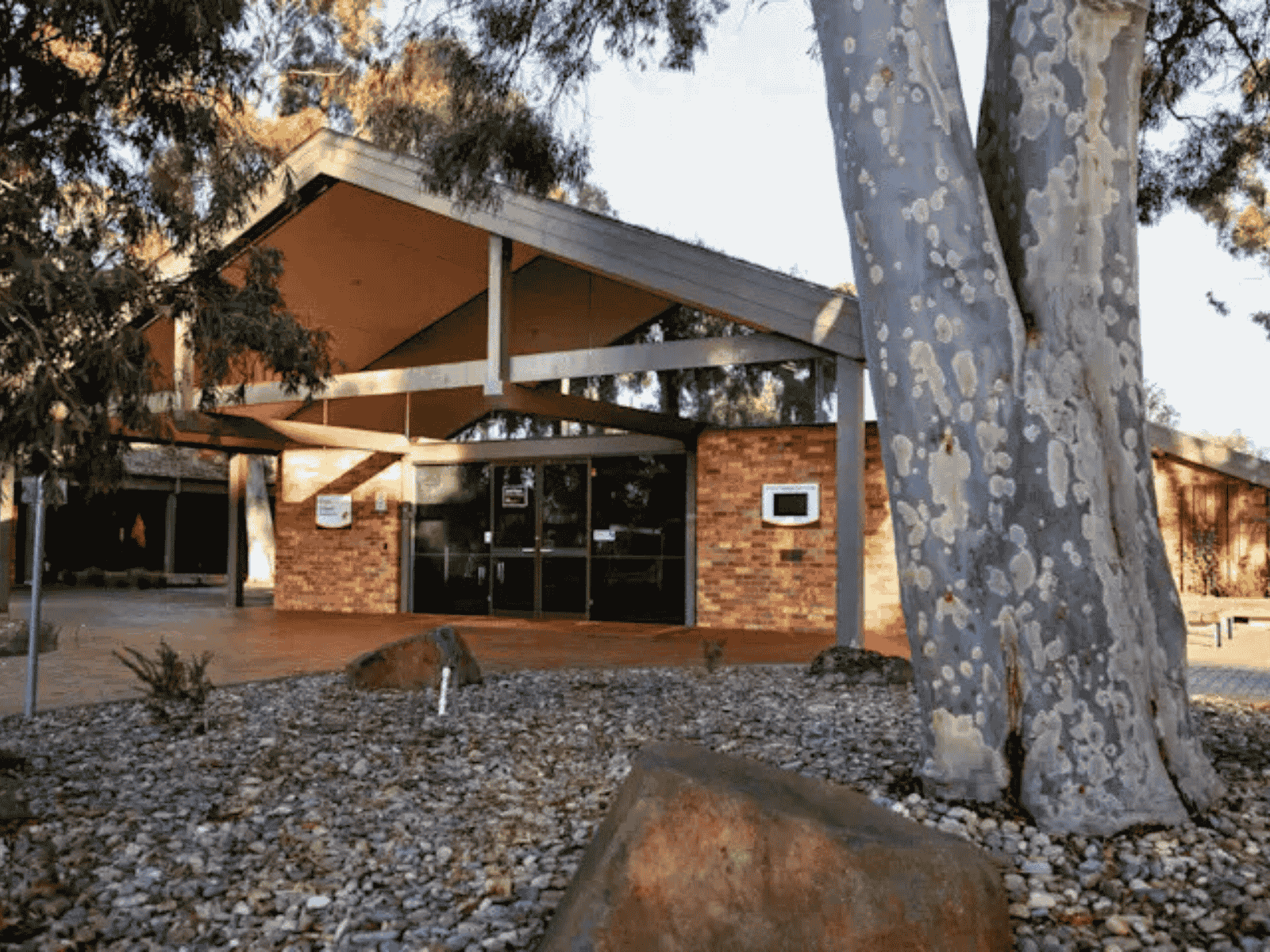 Outside view of The Crick Chapel at Fawkner Memorial Park. Shows trees upon entrance.