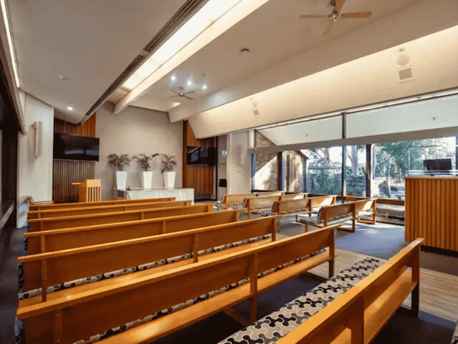 Closeup view of the pews at The Crick Chapel at Fawkner Memorial Park