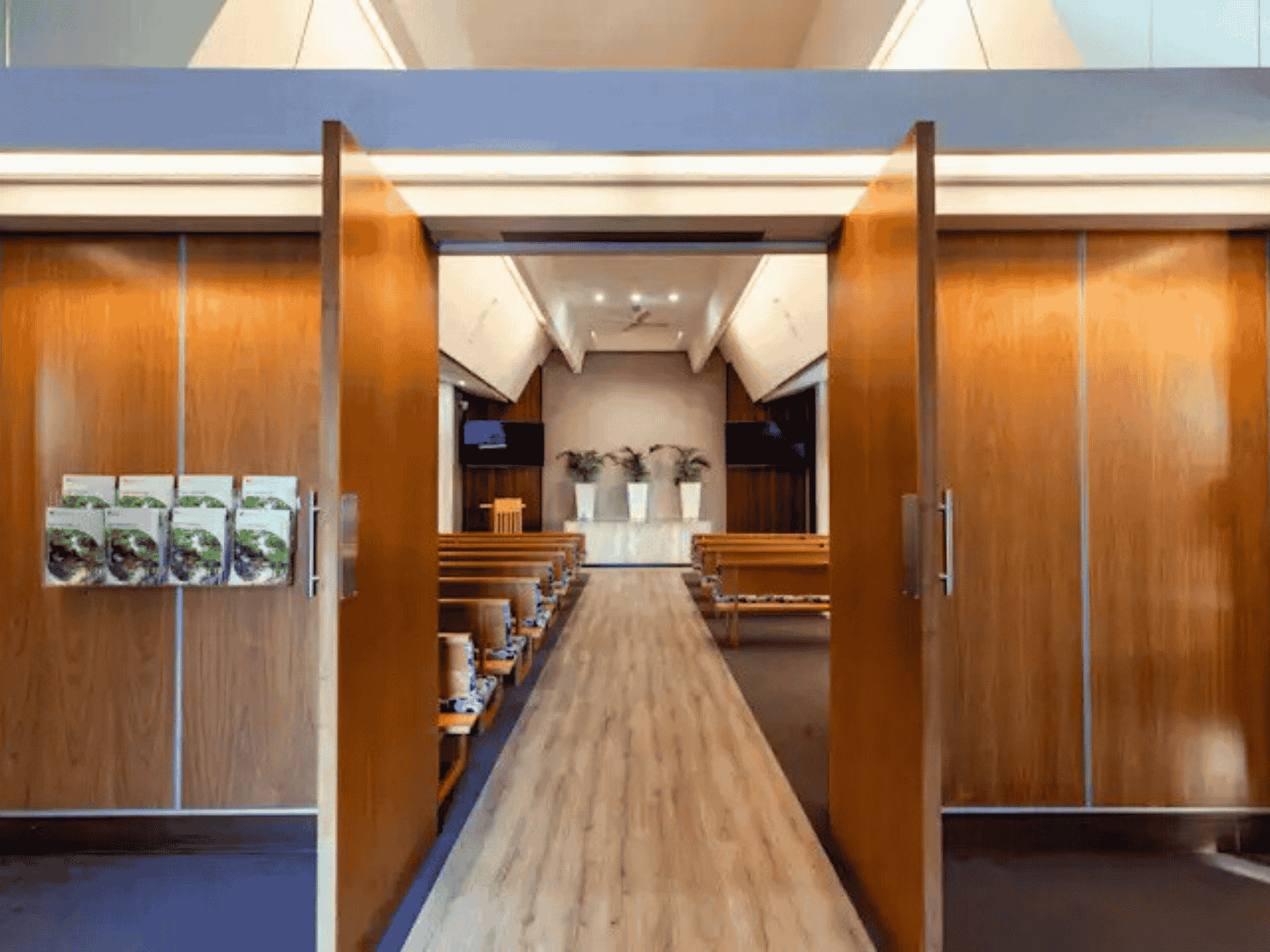Looking through entrance doors to inside The Crick Chapel at Fawkner Memorial Park