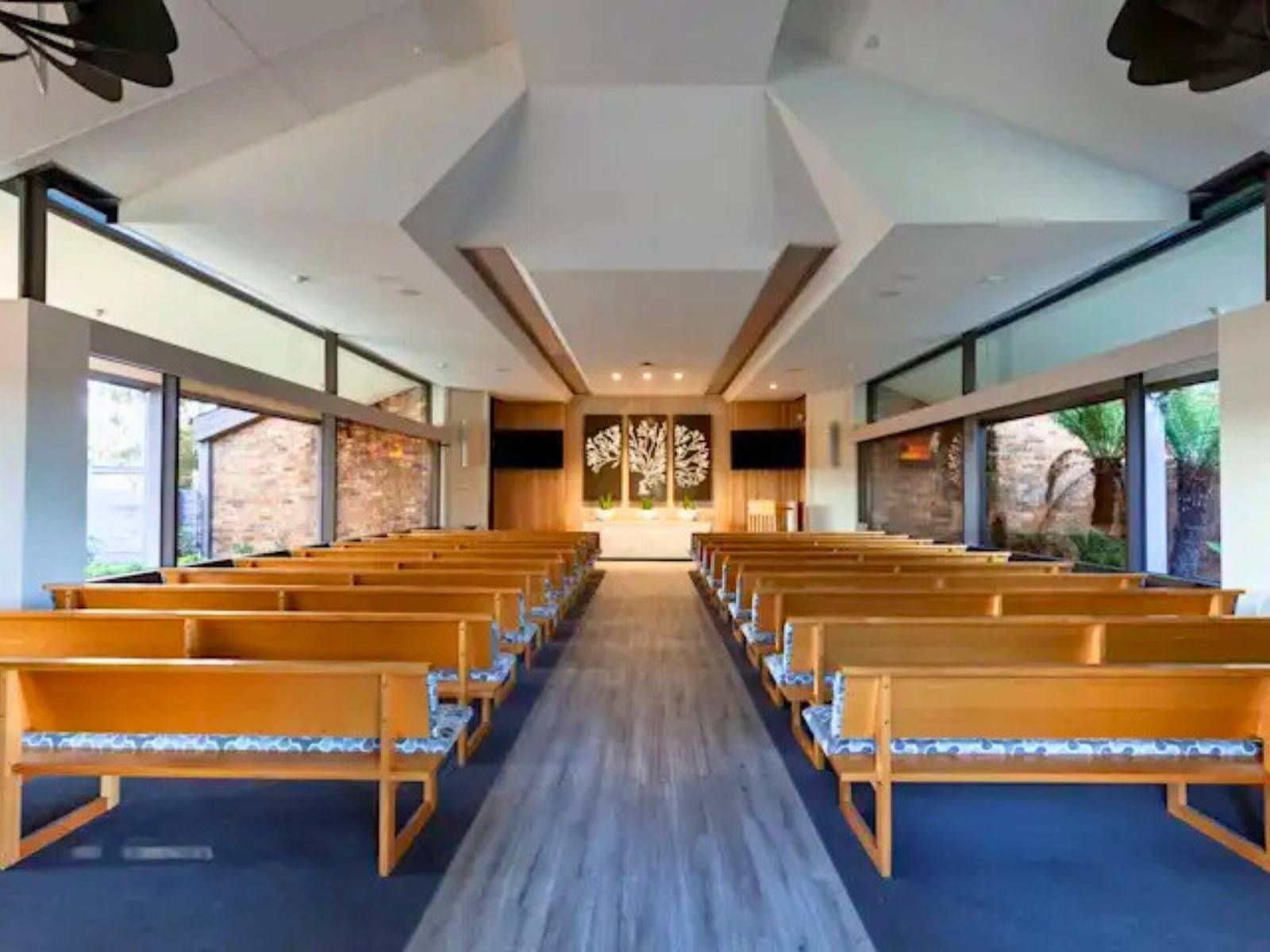 Inside Cordell Chapel at Fawkner Memorial park - rows of empty pews