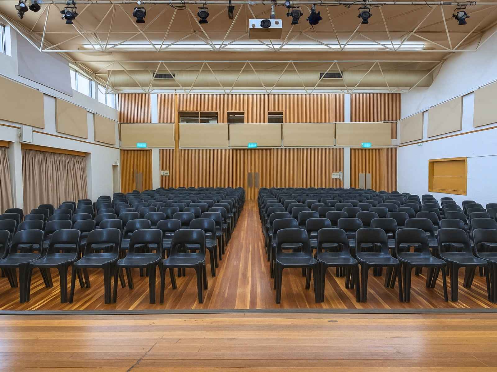 Rear view of chairs and timber-lined back wall.