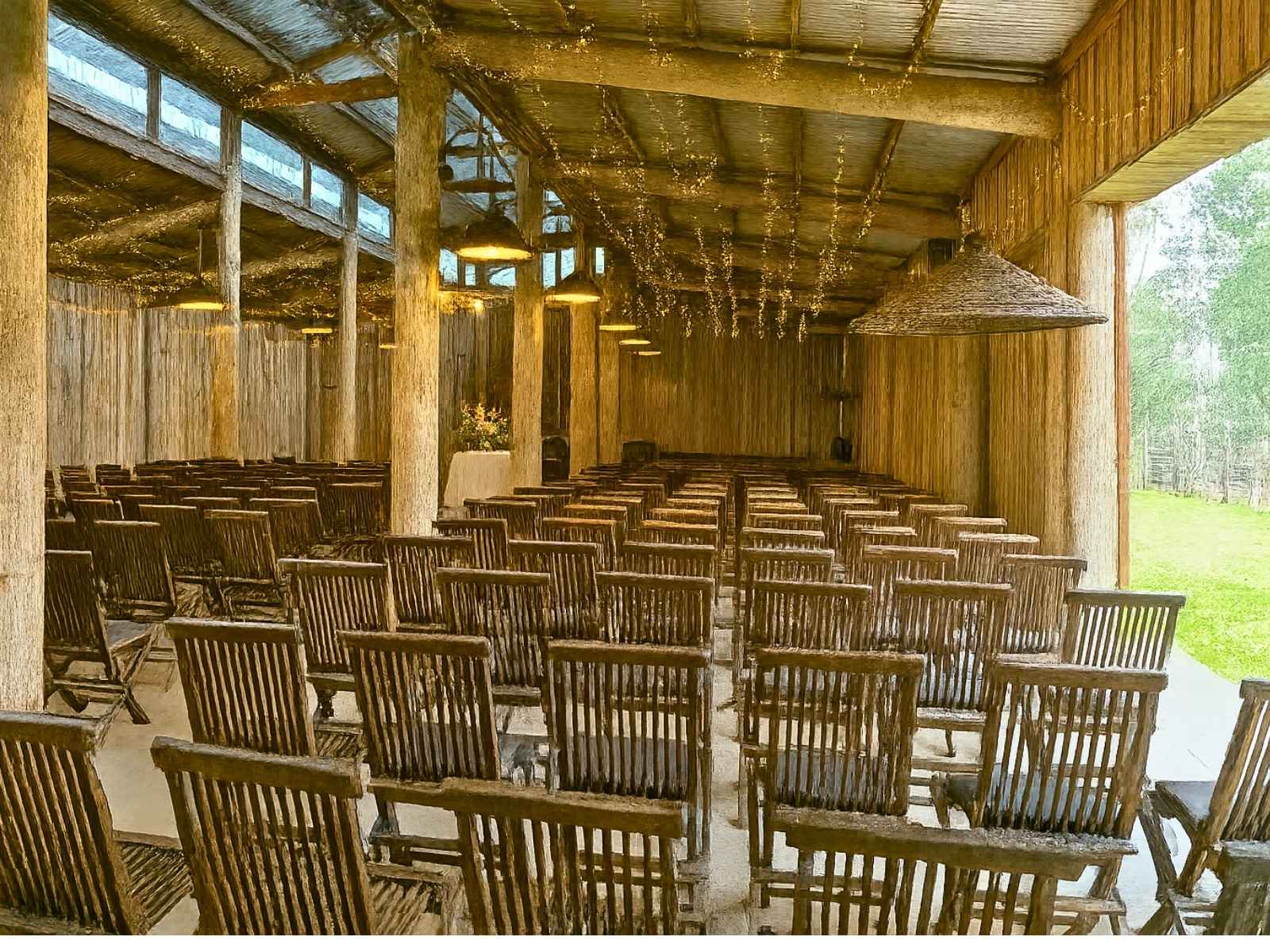 Inside the barn at Tanglewood estate. Chairs set up theatre style facing forward.