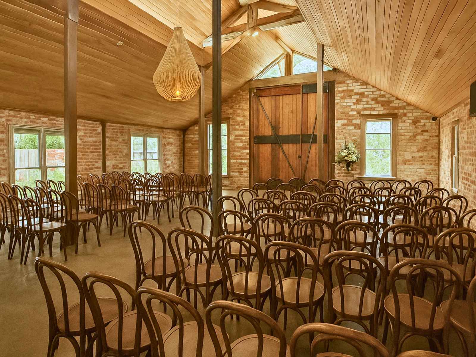 Inside the winery venue at Tanglewood Estate showing the beautiful wooden features including large chandelier.