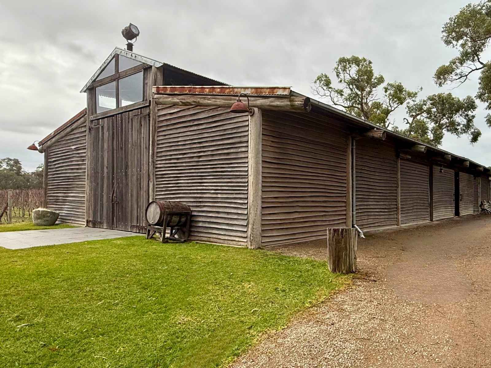 Tanglewood Estate outside of barn showing wooden large structure with grass