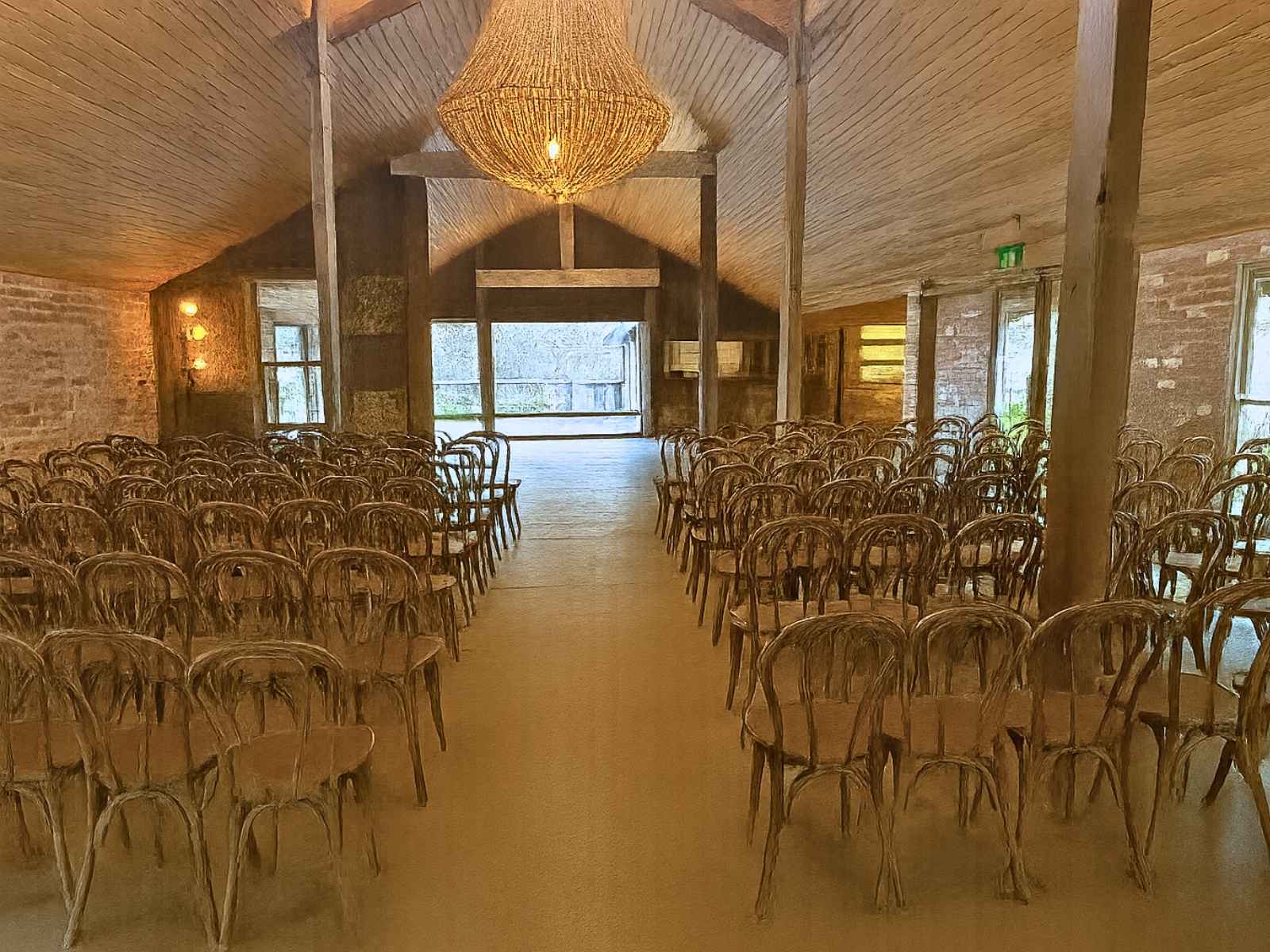 Tanglewood medium sized venue called The Winery. Beautiful seats looking front with stunning chandelier feature above. Wooden structure. perfect for funerals.