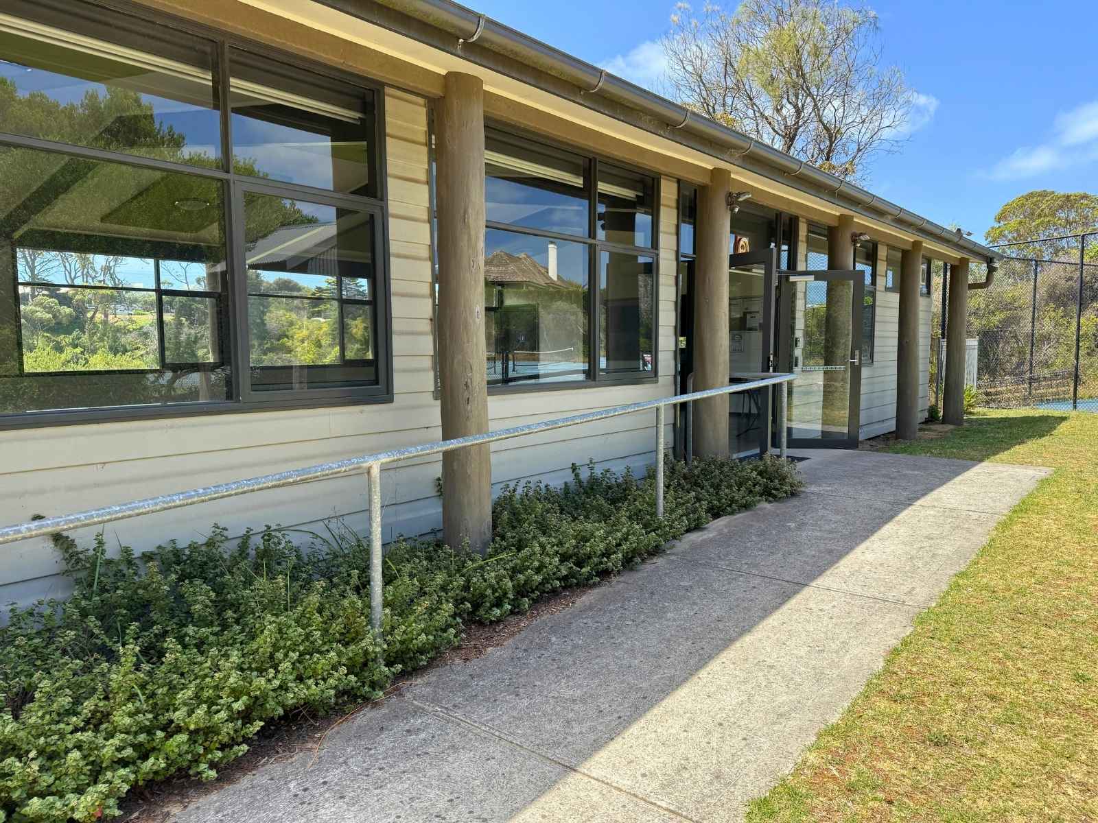 Side view of Watsons Pavilion showing large windows and ramp access to the entrance.