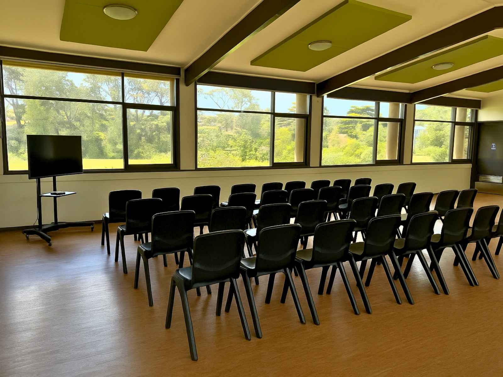 Alternate angle of the interior seating with clear views to the greenery outside.