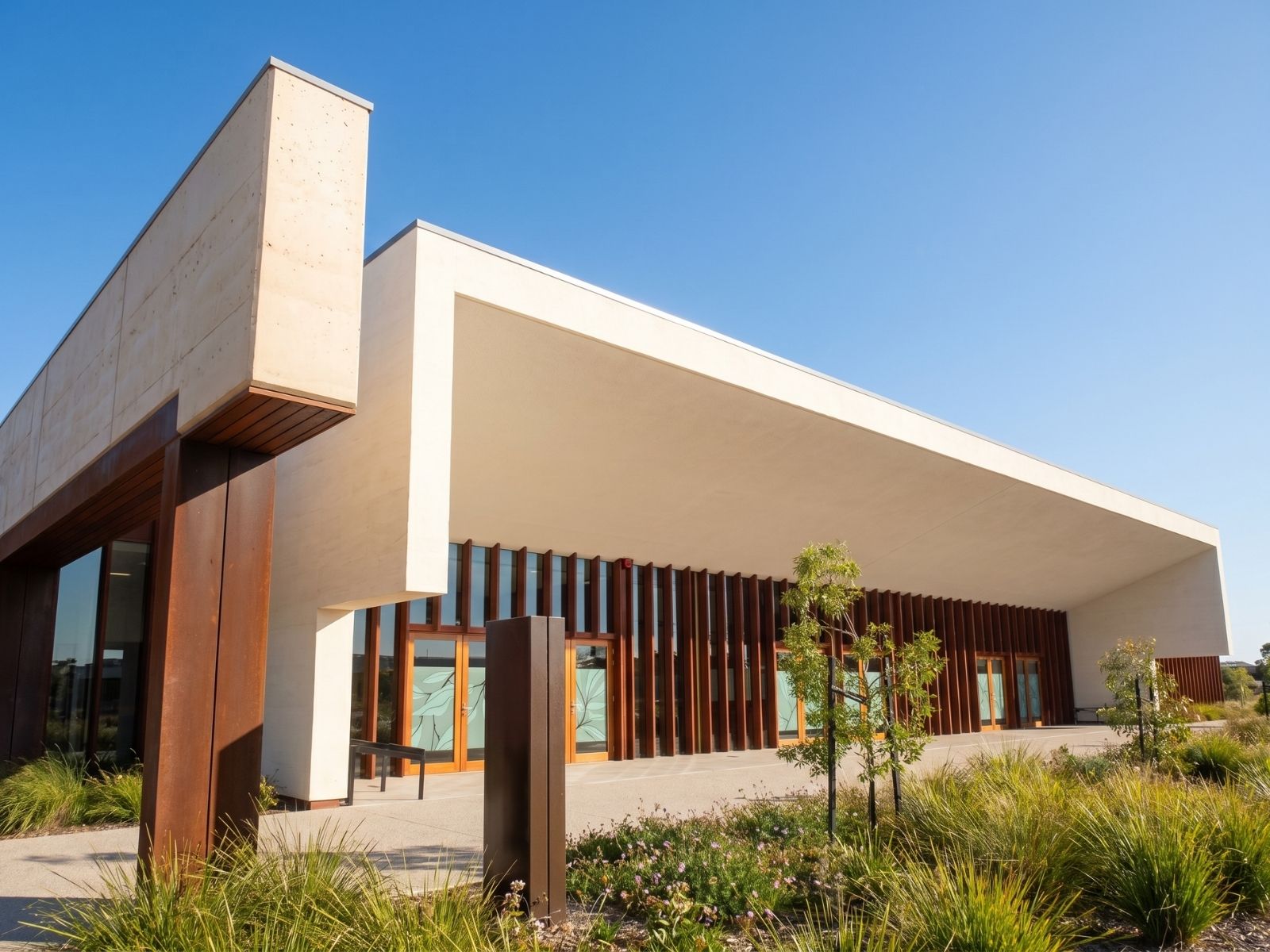 Entrance to Cumulus Chapel at Bunurong Memorial Park, Dandenong South, with angled white portal and Corten fins