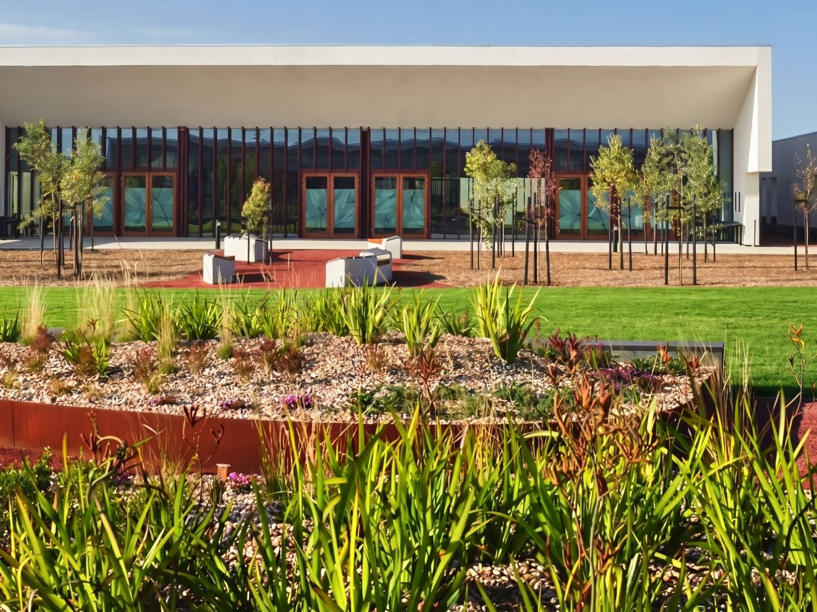 Native garden beds with Corten edging outside Stratus Chapel at Bunurong Memorial Park