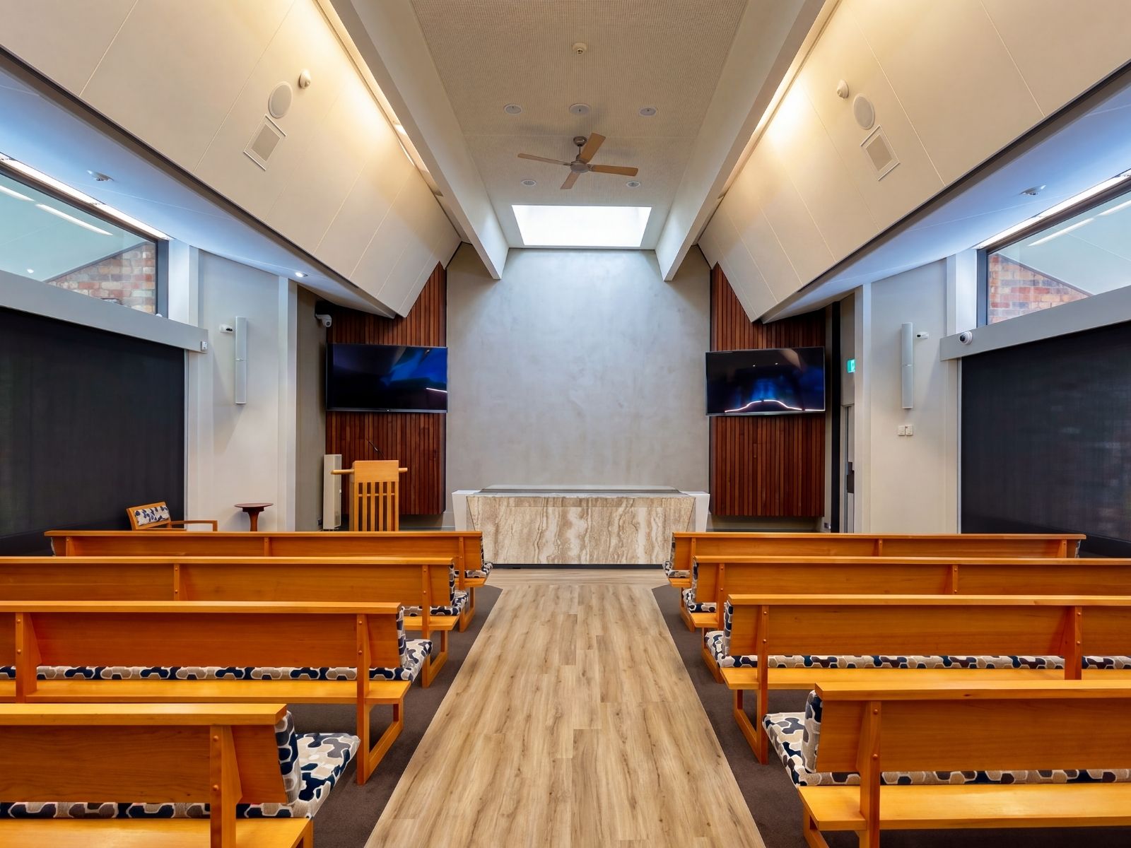 Timber pews and stone altar table inside Crick Chapel at Fawkner Memorial Park