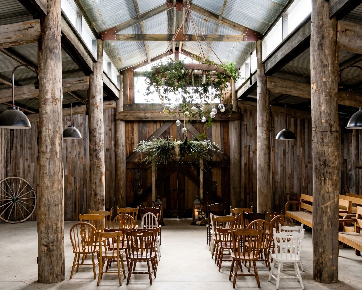 Great timber barn at Tanglewood Estate with high raftered ceiling and hanging greenery
