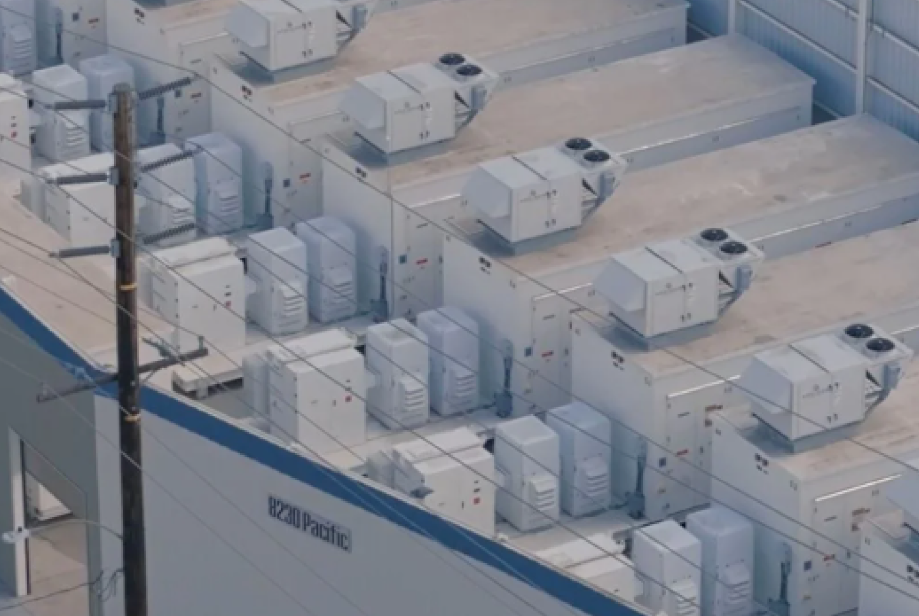Portfolio cover showing rooftop view of multiple white industrial HVAC units installed on a building with power lines in front.
