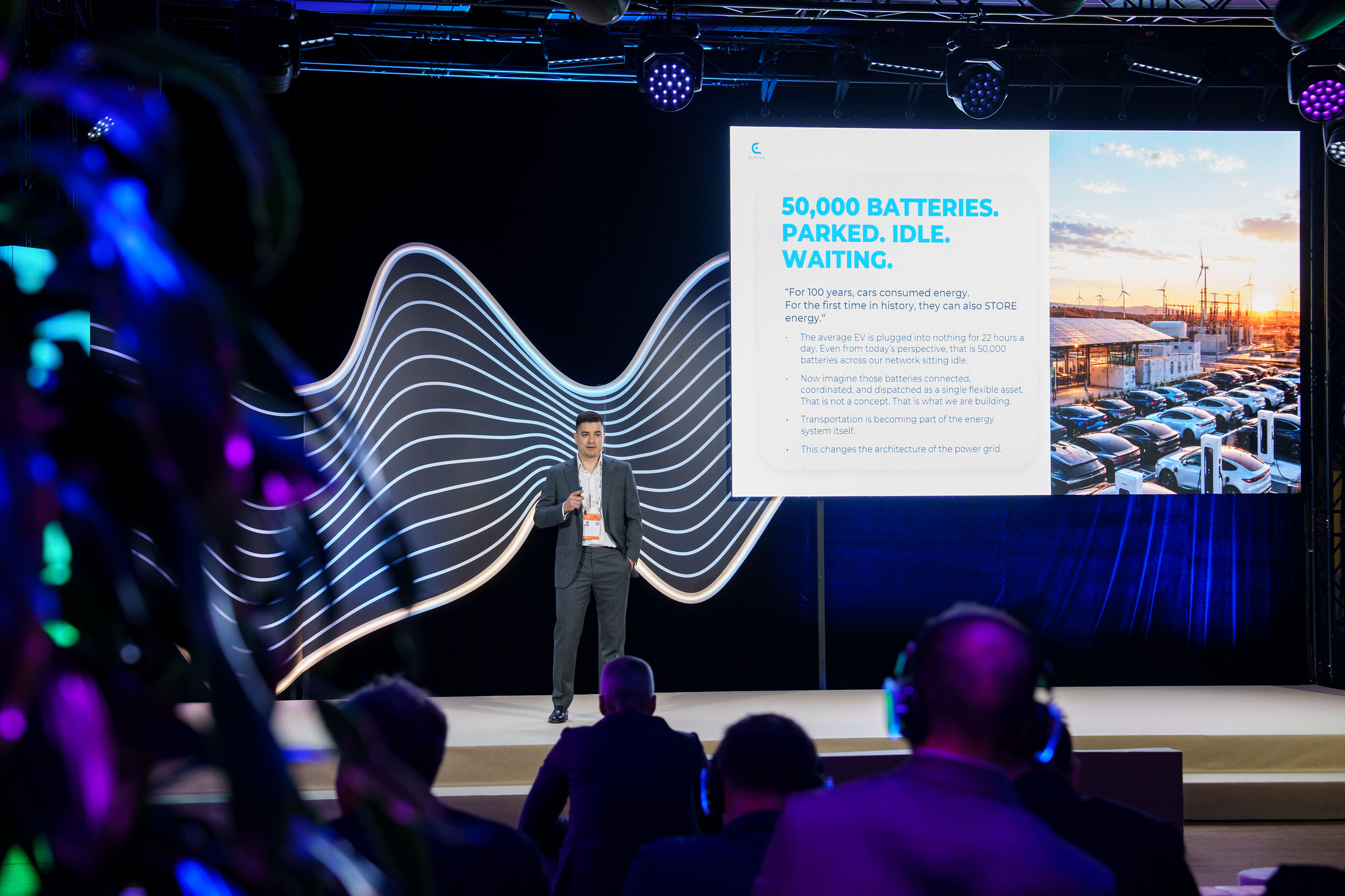 Stefan Spassov presenting the slide '50,000 batteries. Parked. Idle. Waiting.' at the EBRD Annual Meeting in Riga