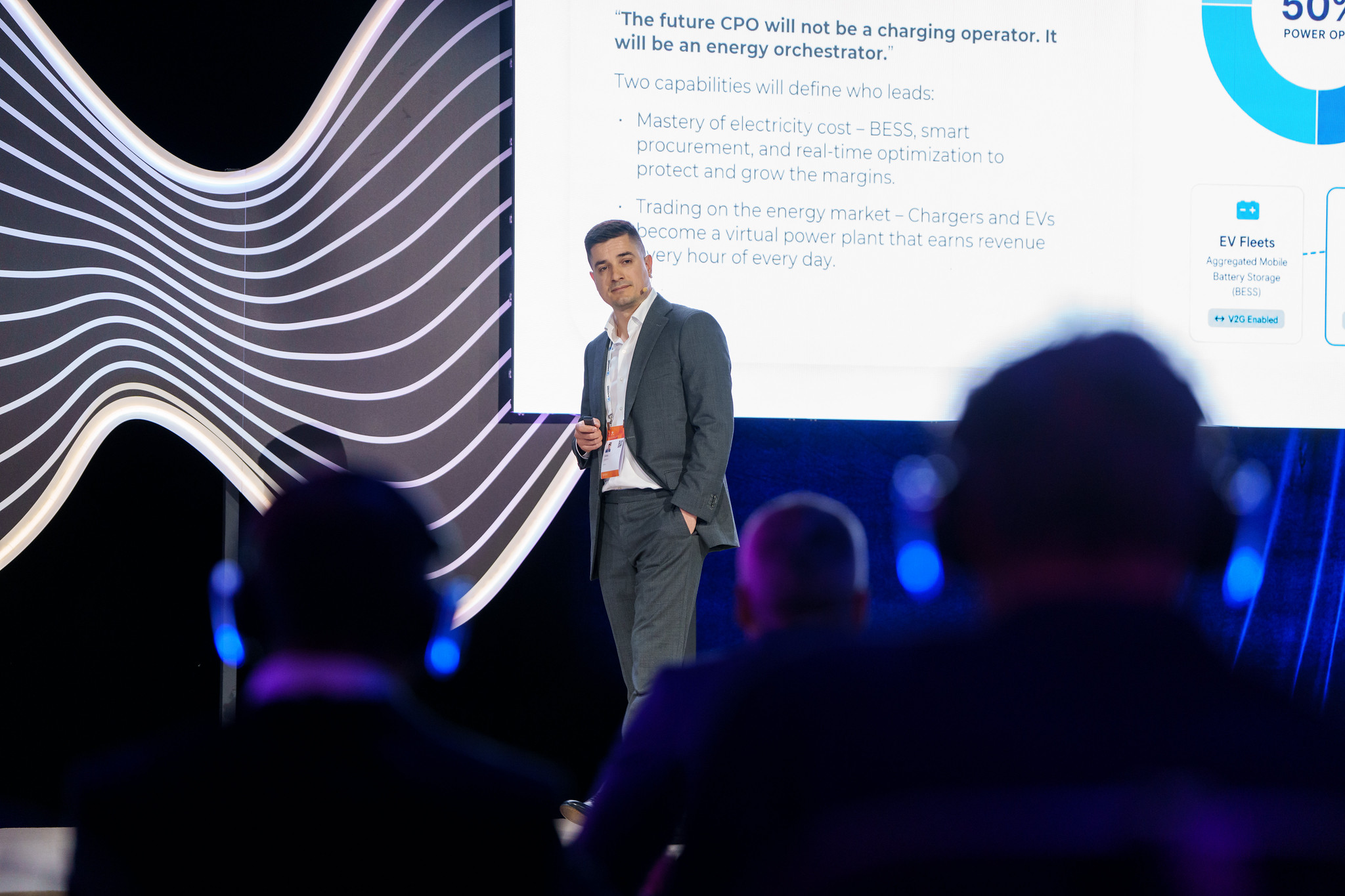 Stefan Spassov in front of the slide 'The future CPO will not be a charging operator. It will be an energy orchestrator.'