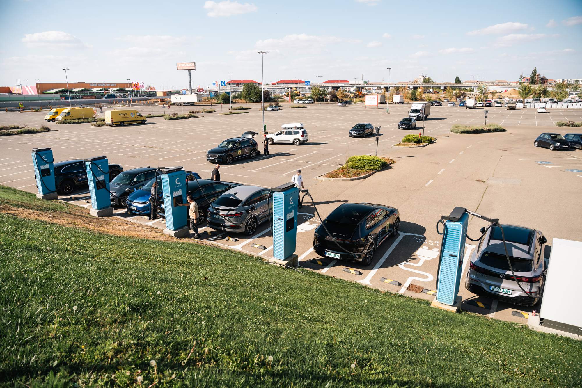 The EUROCHARGE 2026 convoy charging side by side at a row of Eldrive chargers in Oradea, Romania