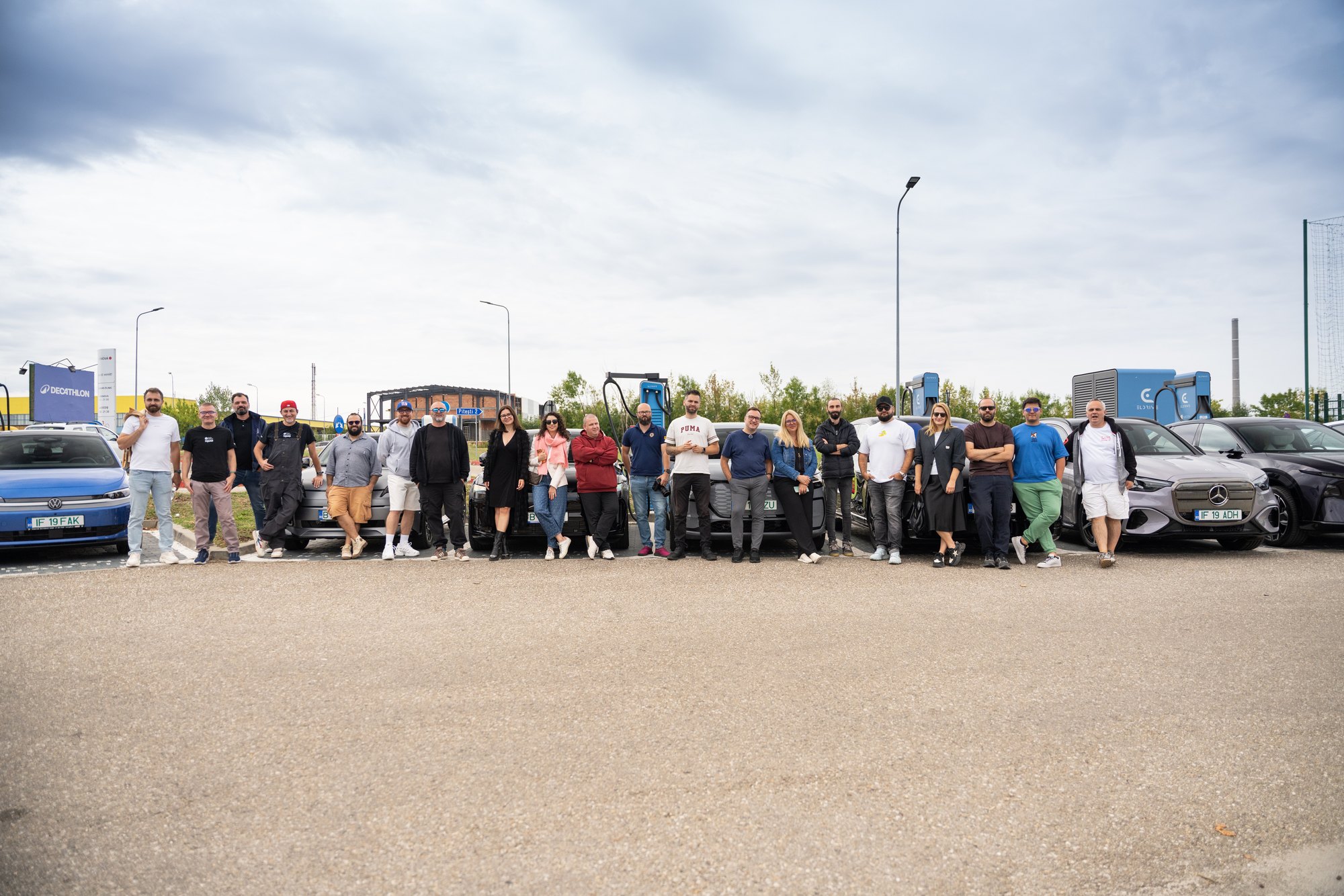 The EUROCHARGE 2026 team with the test cars at an Eldrive charging site in Romania