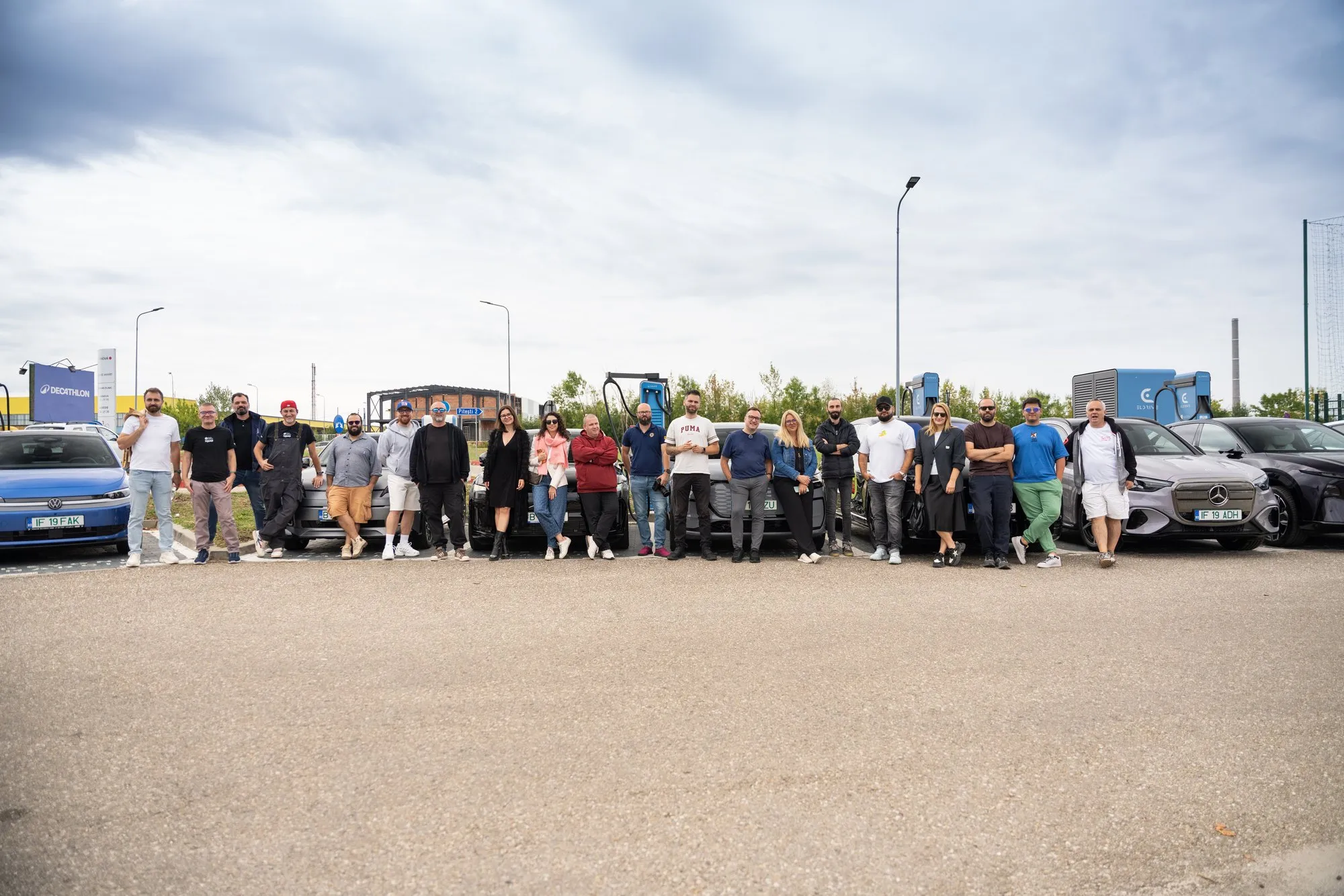 The EUROCHARGE 2026 team with the test cars at an Eldrive charging site in Romania