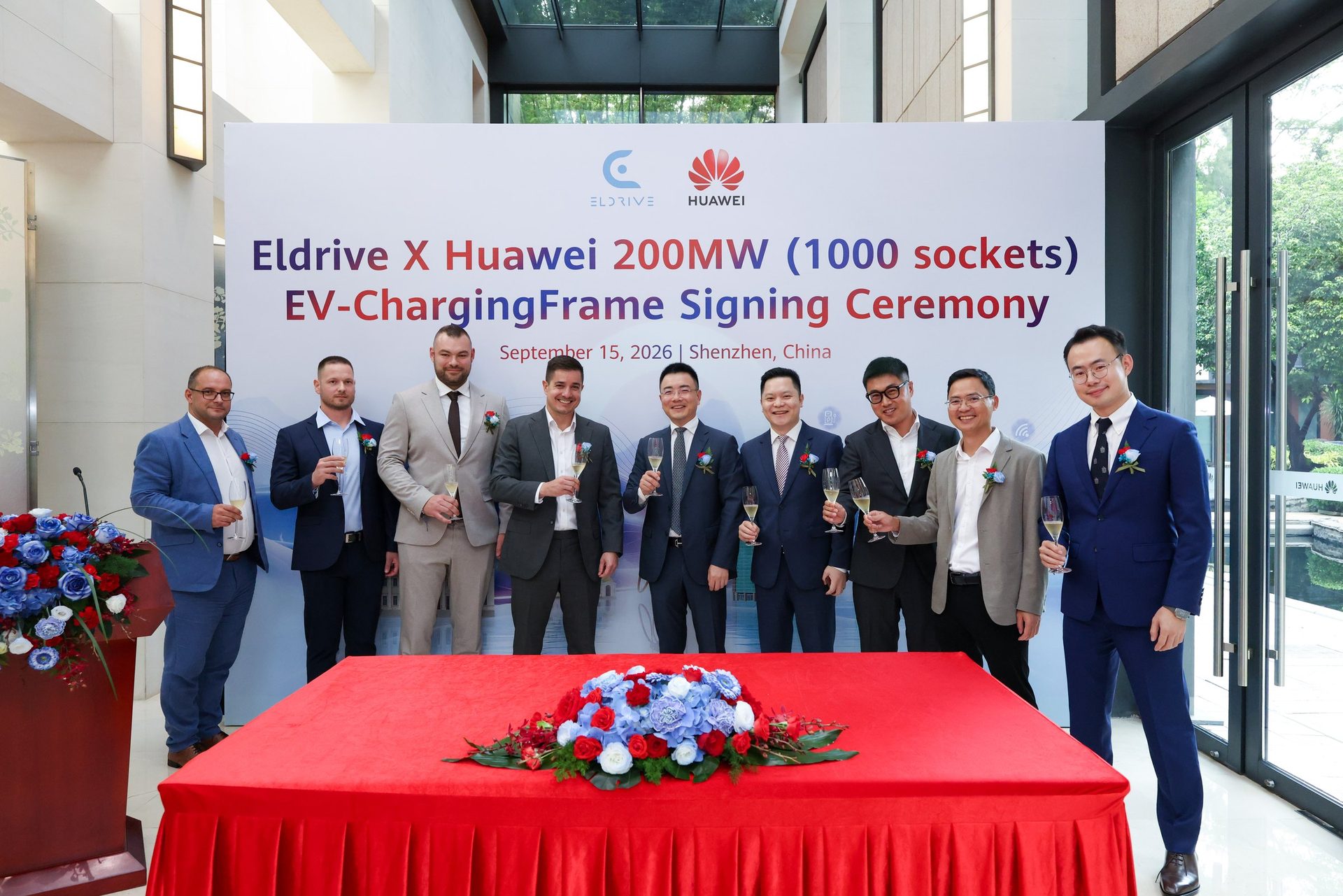Eldrive and Huawei teams raise a toast after signing the framework agreement in Shenzhen