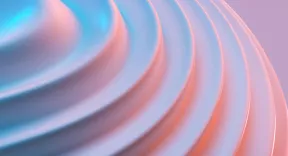 Close-up of a smooth spiral pattern in soft blue and pink shades.