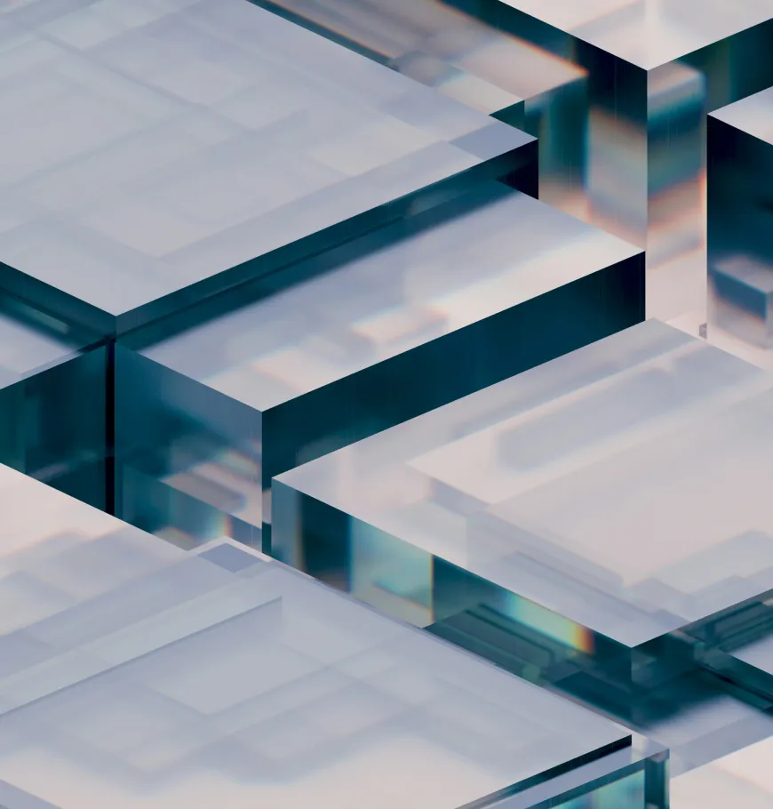 Close-up of translucent overlapping square glass blocks with light reflections and refractions.