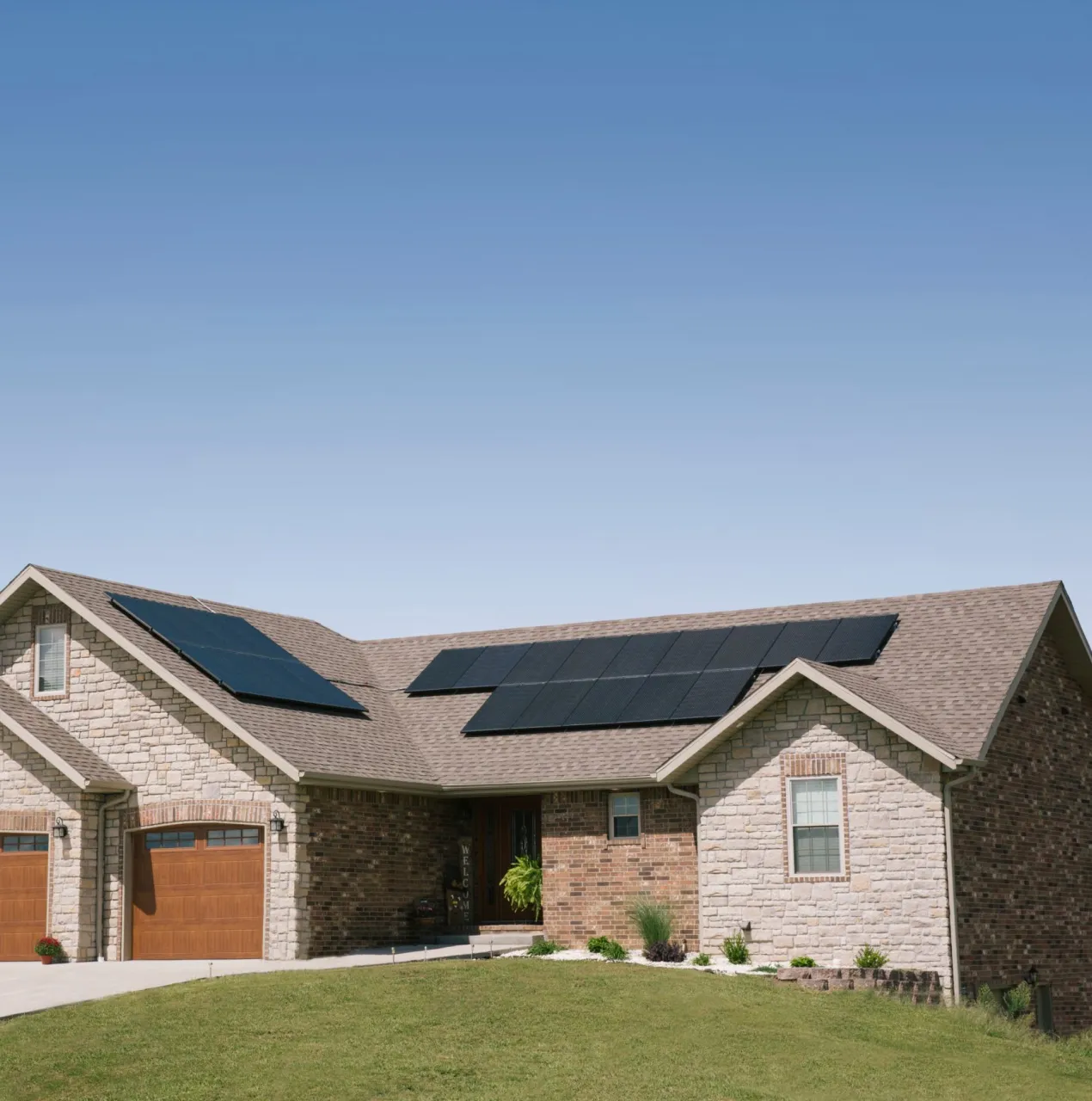 House with solar panels on an asphalt shingle roof